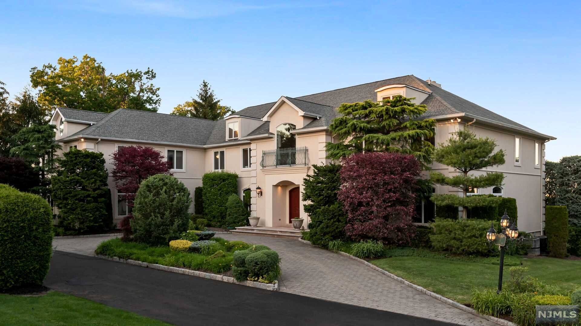 Welcome to this incredible 7 bedroom, 7 full and 1 half bath estate in the desirable Bluff section of Fort Lee, NJ with breathtaking panoramic views of the George Washington Bridge, Hudson River and New York City. This manor features approx. 8,500 sq. ft of living space on 2 floors, plus an additional finished walkout lower level of approx 3,500 sq. ft. Enter through the 2-story foyer to find formal living and dining rooms, a library, a bedroom suite, mud room, laundry room, commercial grade Chef's kitchen with breakfast area and family room. The stunning great room with fireplace features floor-to-ceiling windows and high ceilings making this room bright and sunny with exquisite views and access to the patio overlooking the lush landscaped grounds. Second floor is complete with a large master suite with 2 walk-in closets and luxurious master bath, as well as 2 additional bedroom suites, 2 more bedrooms, a full bath and another family room.