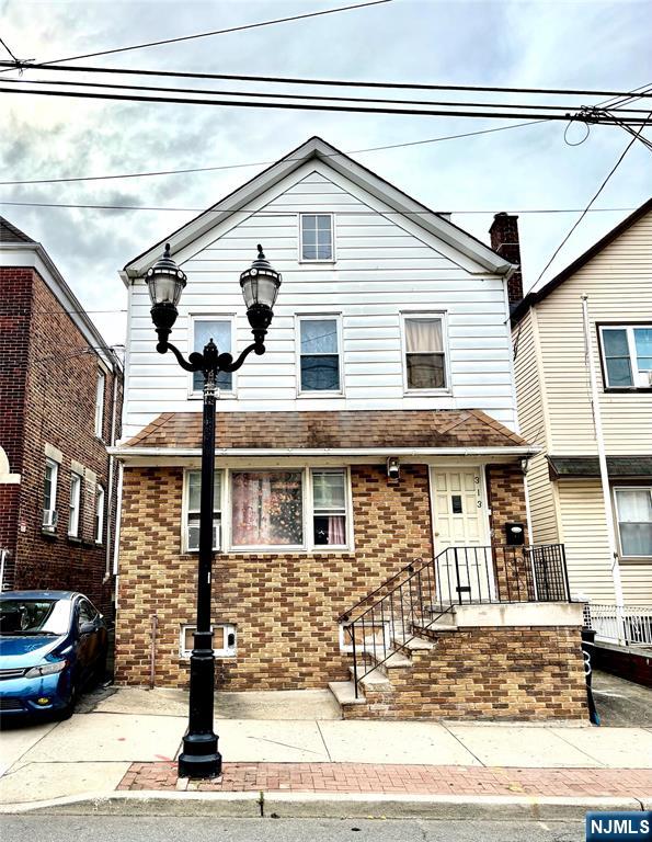 Don't miss this fantastic opportunity to own an income-producing two-family home just minutes from New York City! This versatile property features two spacious apartments, a finished attic with two bonus rooms and a private entrance, plus a fully finished basement complete with a full bath and outside access. Whether you're looking to generate rental income or live in one unit while renting the other, this home offers the perfect blend of comfort, convenience, and potential.