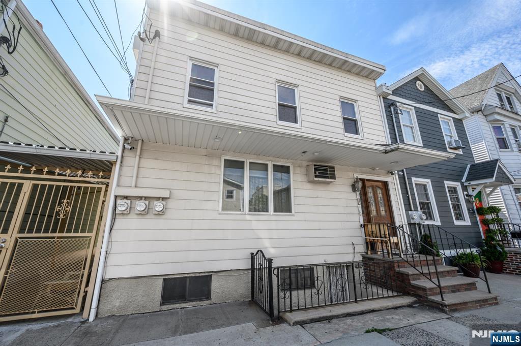 Whether you're looking to expand your investment portfolio or occupy one unit while generating rental income from the other, this well-maintained two-family home in Newark offers exceptional flexibility and value. With separate utilities and private entrances, it's an ideal opportunity for owner-occupants and investors alike. The first-floor unit features a bright living room, eat-in kitchen, sunroom, two comfortable bedrooms, and a full bath with a walk-in shower. The second-floor unit offers a spacious living room, formal dining room, eat-in kitchen, three bedrooms, and a full bath with a walk-in shower. The full finished basement adds even more versatility with its own kitchen, full bath with a stall shower, and multiple bonus rooms that can accommodate a variety of needs. Step outside to enjoy the fenced-in backyard complete with a patio and storage shed, providing the perfect space for outdoor entertaining, relaxing, or additional storage. Additional highlights include wall-unit air conditioning, on-street parking, and separate utilities for added convenience. Conveniently located to the train & bus line for an easy commute + close to shopping, dining, parks and more. Don't miss out! This opportunity will not last!