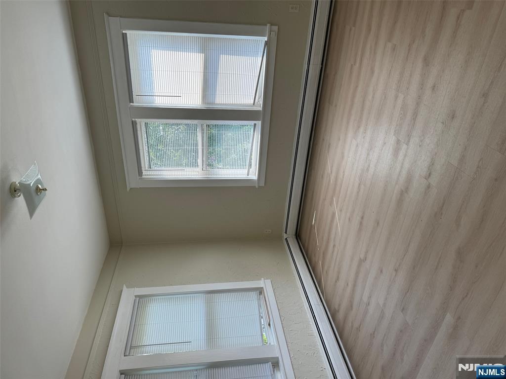 Beautiful 2nd-floor apartment located in a highly sought-after neighborhood! Newly updated home features a brand-new modern kitchen with sleek cabinetry, stainless steel appliances, and elegant finishes. Enjoy 2 generous bedrooms, 2 stylish full bathrooms, and a bright, open layout filled with natural light. Additional highlights include hardwood floors throughout, and a bonus 2 rooms perfect for an office, playroom, or den, 2-zone central A/C, an in-unit washer & dryer, and plenty of storage space. Two dedicated parking spots. An easy commute to NYC.