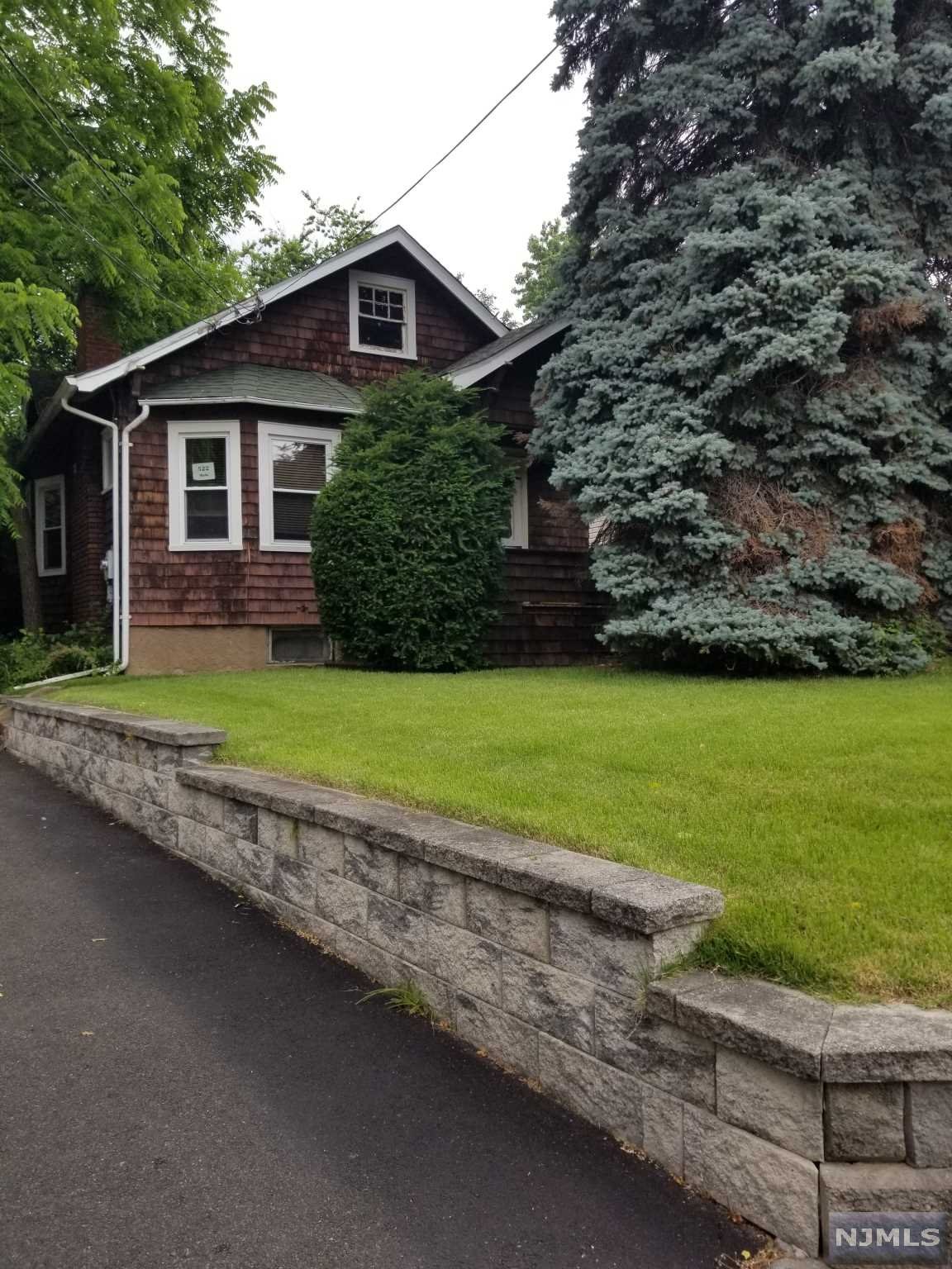 NON FLOOD ZONE!!! This ranch with natural chestnut trim thruout is nestled in the heart of Little Falls just steps from 4 corners. Built in 1918 much of the charm of yesteryear still remains. Stained glass windows flank the wood-burning fireplace with chestnut mantel and gorgeous glass bookcases. Extra long driveway affords parking for 6 cars plus a 2 car garage with rafter/loft area. Current owner has lovingly maintained & updated it since aquiring it in 1989. Updates since 1989 include central air, 200 AMP 1 phase electric service, windows 2005, stackable W/D 2021, Driveway 2021, H/W heater 2021. At this price you can't afford to rent you can own and make this your next address!