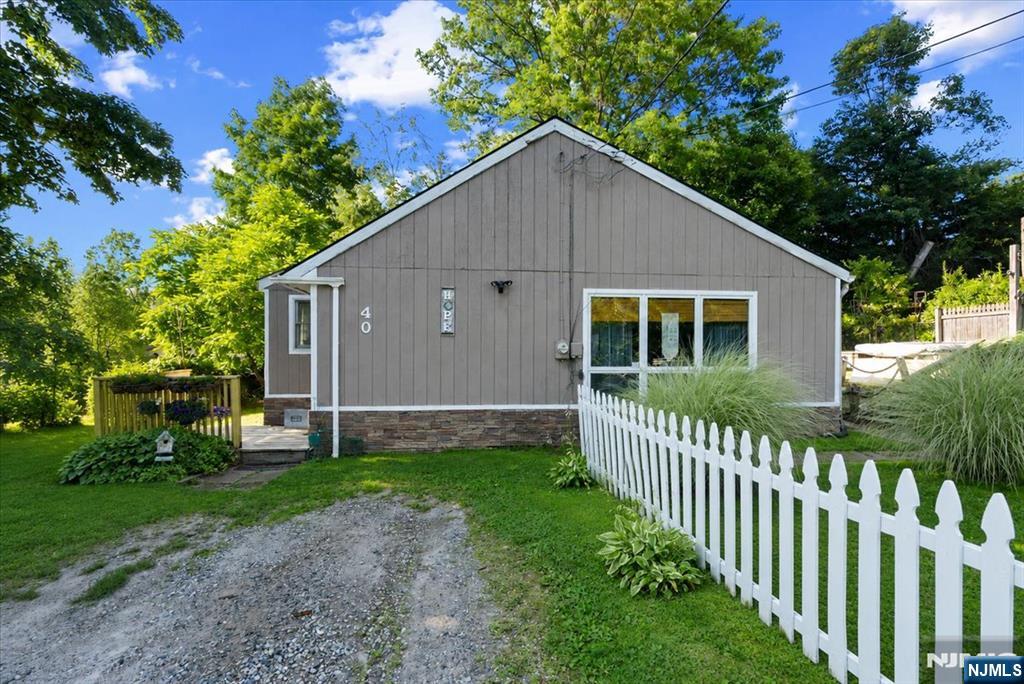 Welcome to this charming Ranch offering the perfect blend of comfort and functionality. This inviting home features 2 bedrooms plus a versatile bonus room, ideal for a home office, guest room, or playroom.The open-concept layout creates a bright and welcoming atmosphere, seamlessly connecting the living, dining, and kitchen areas perfect for everyday living and entertaining. Step outside to enjoy the spacious deck overlooking the backyard, providing the ideal setting for outdoor dining, relaxing, or hosting gatherings. Conveniently located near the lake and sandy beach, as well as Vernon Valley Ski Resort and Mountain Creek, this home offers year-round recreational opportunities, from swimming and boating in the summer to skiing and snowboarding in the winter. Whether you're looking for a full-time residence, a weekend getaway, or an investment property, this is the home that you won't want to miss!