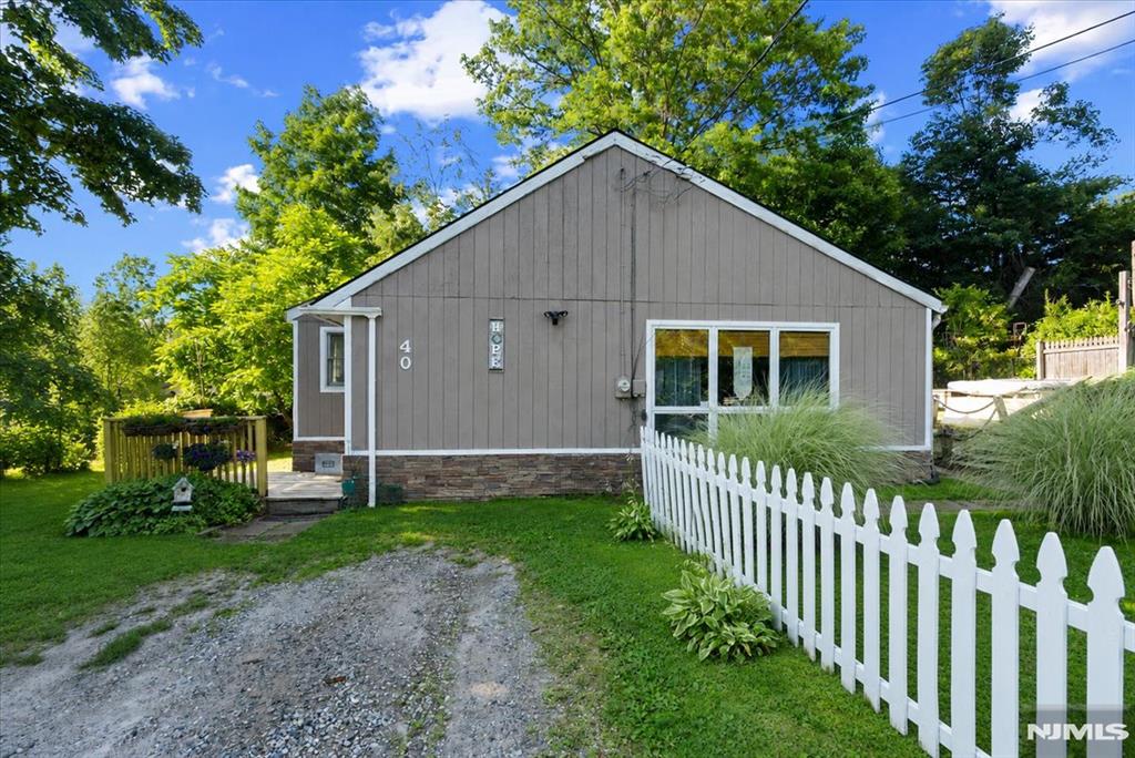 Welcome to this charming Ranch offering the perfect blend of comfort and functionality. This inviting home features 2 bedrooms plus a versatile bonus room, ideal for a home office, guest room, or playroom.The open-concept layout creates a bright and welcoming atmosphere, seamlessly connecting the living, dining, and kitchen areas perfect for everyday living and entertaining. Step outside to enjoy the spacious deck overlooking the backyard, providing the ideal setting for outdoor dining, relaxing, or hosting gatherings. Conveniently located near the lake and sandy beach, as well as Vernon Valley Ski Resort and Mountain Creek, this home offers year-round recreational opportunities, from swimming and boating in the summer to skiing and snowboarding in the winter. Whether you're looking for a full-time residence, a weekend getaway, or an investment property, this is the home that you won't want to miss!
