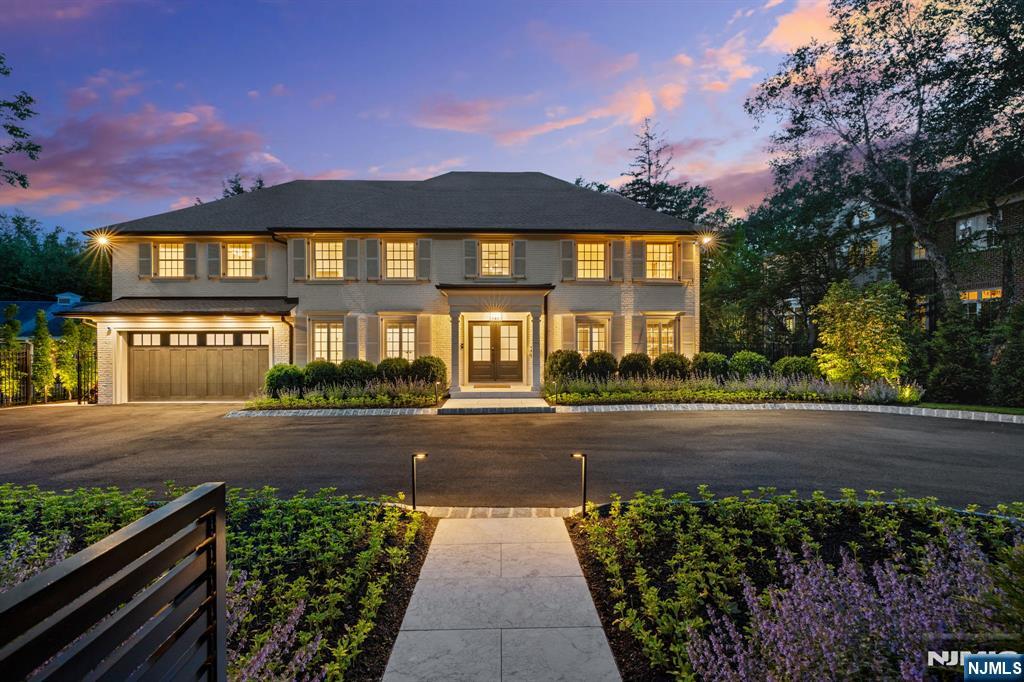 Welcome to one of the most exceptional estates ever offered in Englewood, where thoughtful design, meticulous craftsmanship, & timeless luxury come together in perfect harmony. Tucked behind private gates on beautifully landscaped grounds, this magnificent compound has been completely reimagined through a top-to-bottom renovation & expansion, transforming it into a private resort just minutes from New York City. The main residence offers 8 grand bedrooms, each with its own en-suite bathroom, providing the ultimate in privacy and comfort. The primary suite is a true sanctuary, featuring dual walk-in closets, a steam room, & spa-inspired finishes. Designed to support both intimate family living and large-scale entertaining, the home includes 4 full kitchens, including a state-of-the-art chefâ€™s kitchen & butlerâ€™s pantry, along with multiple lounge spaces, a sports bar, home office, playroom, & 2 laundry rooms. Walls of glass open to a stunning deck, heated pool, jacuzzi, and lit tennis & basketball courts. A detached guest/pool house offers added flexibility. The grounds feature 100+ newly planted trees, curated lighting, a fire pit, and outdoor kitchen, creating a backyard oasis. Fully equipped with smart home technology, including Wi-Fi, Sonos, Lutron, Unifi surveillance & MyQ gates. A rare blend of privacy, luxury, and location.