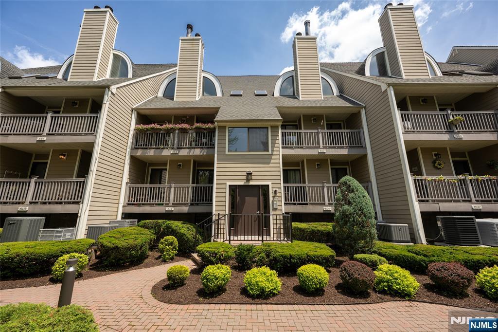 Discover comfort and convenience at River Renaissance in East Rutherford. This sunny and inviting 2 bedroom, 1.5 bath condo offers a flexible open concept layout with vaulted ceilings, a fireplace, and access to a balcony with peaceful views. The kitchen features granite countertops and new cabinetry, perfect for everyday living and entertaining. Upstairs you'll find a large bedroom with double closets, a renovated full bath with laundry, and a versatile loft-style second bedroom with room for a home office. The two-car tandem garage includes built-in storage and interior entry, with additional parking available throughout the complex. Ideally located near parks, transit, and major highways, plus low HOA fees and not located in a flood zone. A great place to call home!