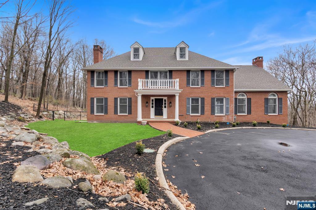 Set upon a sprawling 3.55-acre estate within the prestigious enclave of Franklin Lakes, this meticulously reimagined residence harmoniously blends architectural elegance with pastoral serenity. The expansive interior encompasses over 3,900 square feet of refined living space, further augmented by a comprehensive walk-out lower level that offers a floor plan as versatile as it is sophisticated. Throughout the home, generously proportioned rooms are bathed in an abundance of natural light, creating an inviting atmosphere that transitions seamlessly from intimate daily life to grand-scale entertaining. The residence features four palatial bedrooms and four full bathrooms, complemented by a dedicated study designed to serve as a quiet sanctuary for the modern professional. Character and warmth are woven into the homeâ€™s design through three stately wood-burning fireplaces, which serve as timeless focal points within the luminous living areas. This property represents a rare opportunity to secure significant, private acreage in one of Bergen Countyâ€™s most coveted communities, offering an unparalleled lifestyle of privacy and distinction.