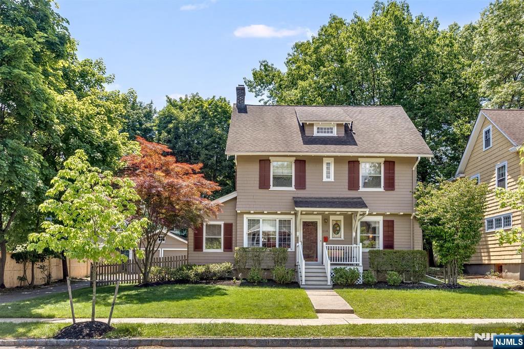 Tucked away on a quiet cul-de-sac in the heart of Upper Montclair, this beautifully updated Colonial offers the rare combination of neighborhood charm, flexible living space, and exceptional walkability. Just moments from Upper Montclair shops, restaurants, Bellevue Theatre, parks, and direct NYC train and bus access, this location captures the very best of Montclair living. The inviting first floor blends warmth and functionality, featuring a spacious living room with wood-burning fireplace, formal dining room, and an eat-in kitchen overlooking the backyard. A mudroom with direct outdoor access adds everyday convenience, while a sun-filled family room/playroom and renovated powder room complete the main level. The second floor offers three generously sized bedrooms and a full hall bath, plus a recently renovated laundry room with ample storage. The private third-floor primary suite provides a peaceful retreat with skylights and en-suite bath, plus an additional bedroom currently used as a home office ideal for today's flexible lifestyle needs. Step outside to a private fenced backyard designed for everyday enjoyment, with a deck overlooking an inviting yard with room for play, gardening, and relaxed outdoor gatherings. A detached two-car garage adds convenience and storage. A rare opportunity to enjoy space, character, and true walk-to-town living in one of Upper Montclair's most sought-after neighborhoods.