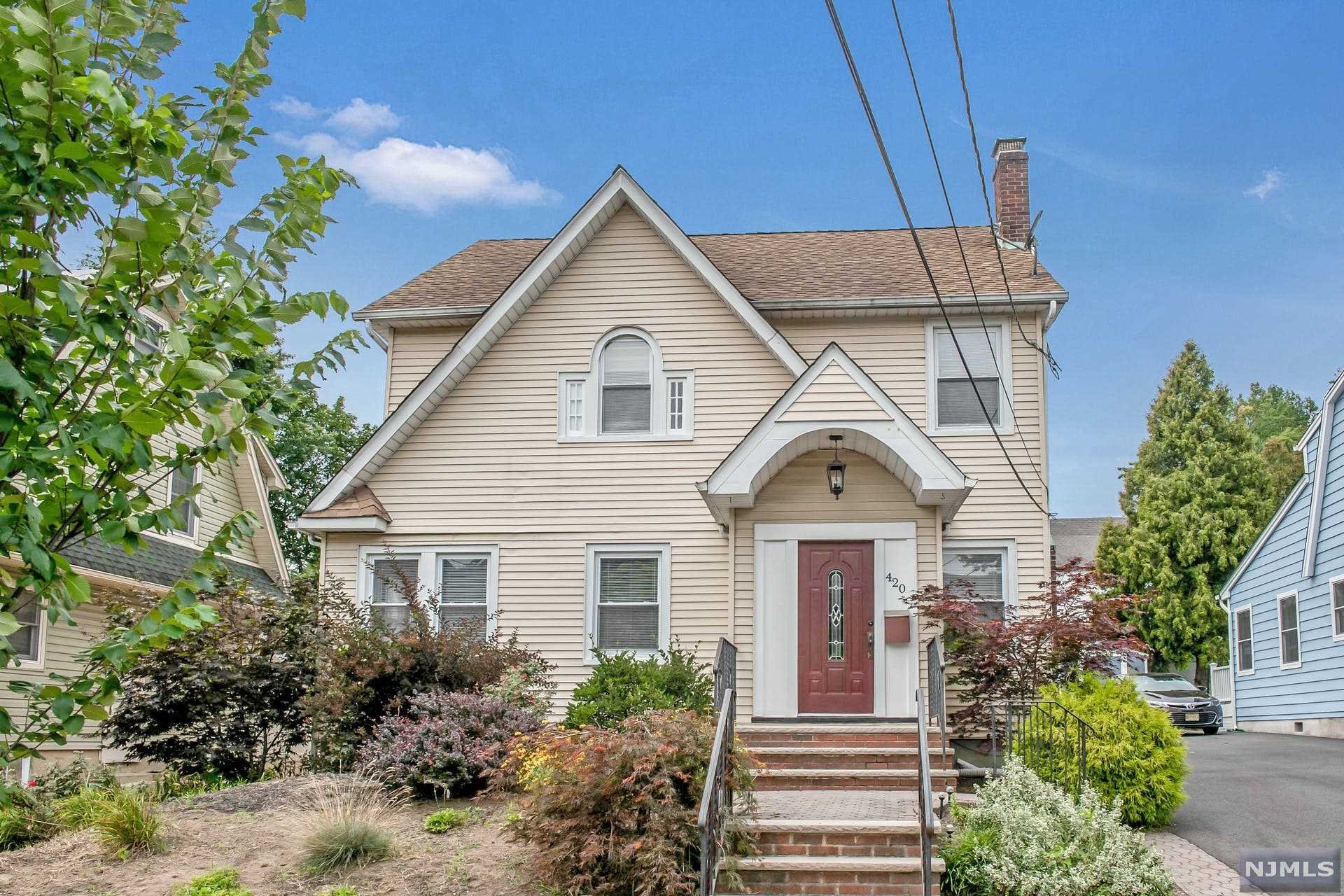 Updated 3+ BR, 2.5 bath, side hall colonial in quiet residential area. This bright and sunny home offers large living room with custom wood burning fireplace, DR with sliding doors to deck and private backyard, one car detached garage, and shared driveway. Kitchen with granite and stainless steel appliances; sunroom and powder room complete the first floor. Second floor features 3 nice size bedrooms w/overhead lighting, ceiling fans and FBTH. Third floor is fully finished w/two bonus rooms. Full finished basement with new floor and FBTH, laundry and storage. Central AC, hardwood floors, newer windows. Close to parks, shopping, transportation and houses of worship. Move right into this spacious and sunny home!
