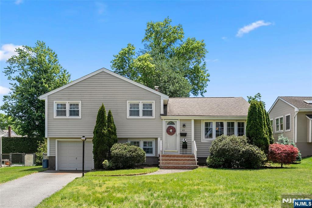 Contact Listing Agent Hojin "Athena" Lee at 201-208-0135. Nestled on a quiet street in the highly sought-after Coleman School neighborhood of Glen Rock, this well-maintained home offers the perfect blend of comfort and convenience. Set on an expansive 10,498 sq ft lot, the property features a fenced backyard with patio, attached garage, and close proximity to Saddle River County Park and the Duck Pond. Enjoy an exceptional commuter location with NYC bus transportation nearby and Coleman School close to the home. Interior highlights include central air conditioning, a primary suite with ensuite bath. Recent updates include a new chimney liner (2024), renovated hallway bathroom (2023), new roof and exterior siding (2018), and new front steps with paver driveway (2018). Mature trees previously near the home with potential structural impact were professionally removed from the front and backyard, improving safety and openness. Additionally, 240V outlet with 150-amp electrical service available for future EV charger installation.