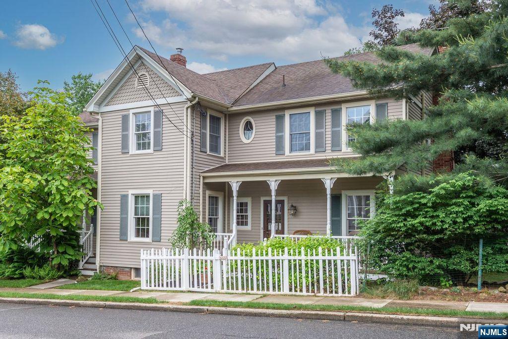 This Turn of the Century Farmhouse was Thoughtfully Renovated with Oversized Anderson Windows in all the Right Places , Central Air & All the Modern Conveniences from A Gourmet Kitchen to Fresh Modern Bathrooms. Delightfully Spacious Rooms , Two Rocking Chair Porches frame the Exterior. So much to LOVE about this home - 9 foot ceilings, the Old Water Pump at Front Walk (no longer functional), Charming Porches with trex decking, Lazy Waterfall to Pond, Garden Patch ready to plant, 3 Car Garage w/Loft Storage, Great Storage in Attic, Basements & Closets & 1st floor Laundry.