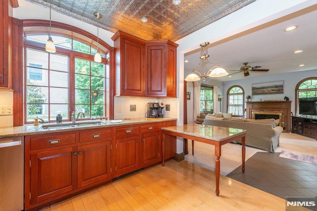 This Turn of the Century Farmhouse , LARGER than it appears in pics & from the street at approx 2300 sq ft, was Thoughtfully Renovated with Oversized Anderson Windows in all the Right Places , Central Air & All the Modern Conveniences from a Gourmet Kitchen to Fresh Modern Bathrooms. Delightfully Spacious Rooms , Two Rocking Chair Porches frame the Exterior. So much to LOVE about this home - 9 FOOT CEILINGS on 1st floor , the Old Water Pump ( no longer functional ) at Front Walk, Charming Porches with TREX Decking, Lazy Waterfall to Pond, Garden Patch ready to plant, 3 CAR GARAGE w/Loft Storage, Great Storage in Attic, Basements & Closets & 1st Floor Laundry.