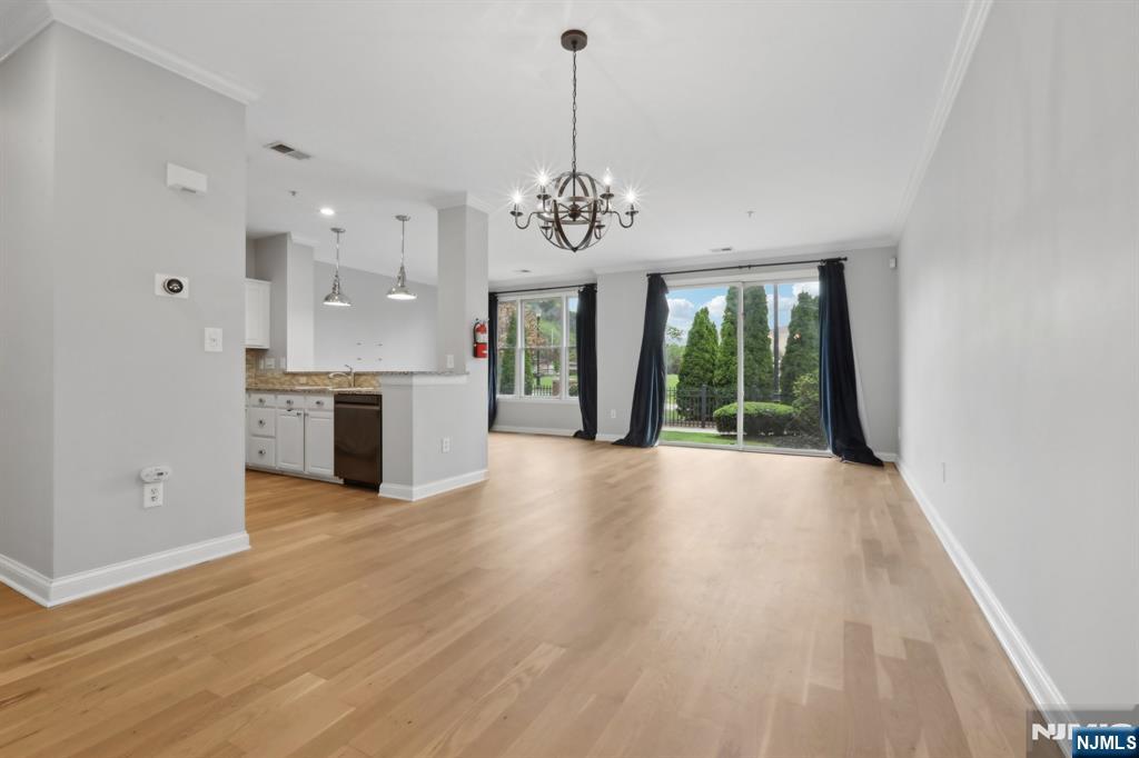 Sought-After Riverfront Bulls Ferry Bergen-Style Townhome â€“ Loaded with Upgrades! Enjoy upscale waterfront living in this upgraded Bergen-style townhome in the desirable Bulls Ferry community. Ideally located near guest parking and just steps from the Hudson River, boardwalk, park, and amphitheater, this home offers comfort and convenience. The entry foyer opens to a bright, open-concept living/dining area with new hardwood floors and custom lighting. Double sliding glass doors lead to a private patio, perfect for relaxing. The galley kitchen features granite countertops, stainless steel appliances, and ample cabinetry. Upstairs, the primary suite offers a private balcony, large walk-in California closet, and a renovated en-suite bath. The second bedroom is ideal for guests or a home office. The second full bath includes a soaking tub. Thereâ€™s also room for a work-from-home setup. Highlights: California closets & added shelving Newer washer and dryer Parking for two: garage with storage + driveway Central heating and cooling Community amenities include: Two outdoor pools with Jacuzzis Playground and waterfront promenade Free shuttle to ferry and light rail Steps to the 158 NJ Transit bus to NYC Close to restaurants, shopping, and parks This well-maintained home offers style, function, and a prime location on the Gold Coast. Schedule your tour today!