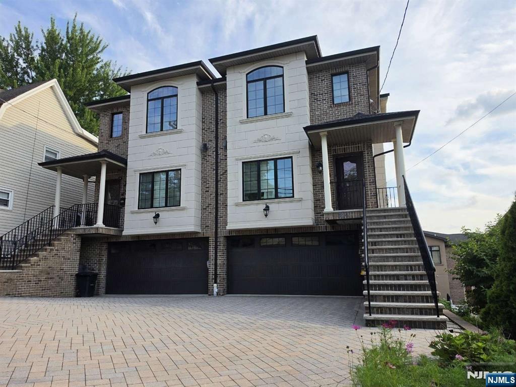 Welcome to the sweet home located on 304 East Palisades Blvd, Unit B. This beautiful duplex (built in 2015) features unobstructed, panoramic views that bring abundant natural light into the home throughout the day. Step inside to an expansive sun-drenched open-concept layout. The main level seamlessly connects the spacious dining area and a formal living space to a gourmet chef's kitchen, granite countertops, rich dark wood cabinetry, and stainless-steel appliances. Gleaming hardwood floors flow throughout. The home offers 4 bedrooms and 3.5 bathrooms with 2-car garages and up to 4-car parking spaces in a long, paved driveway. The fully finished ground level has tile floors, a full bedroom, and a full bathroom, which is ideal for use as a guest suite or home office. Additional highlights include multiple-zone heating, central air conditioning, and convenient access to NYC transportation, shopping, restaurants, and major highways.