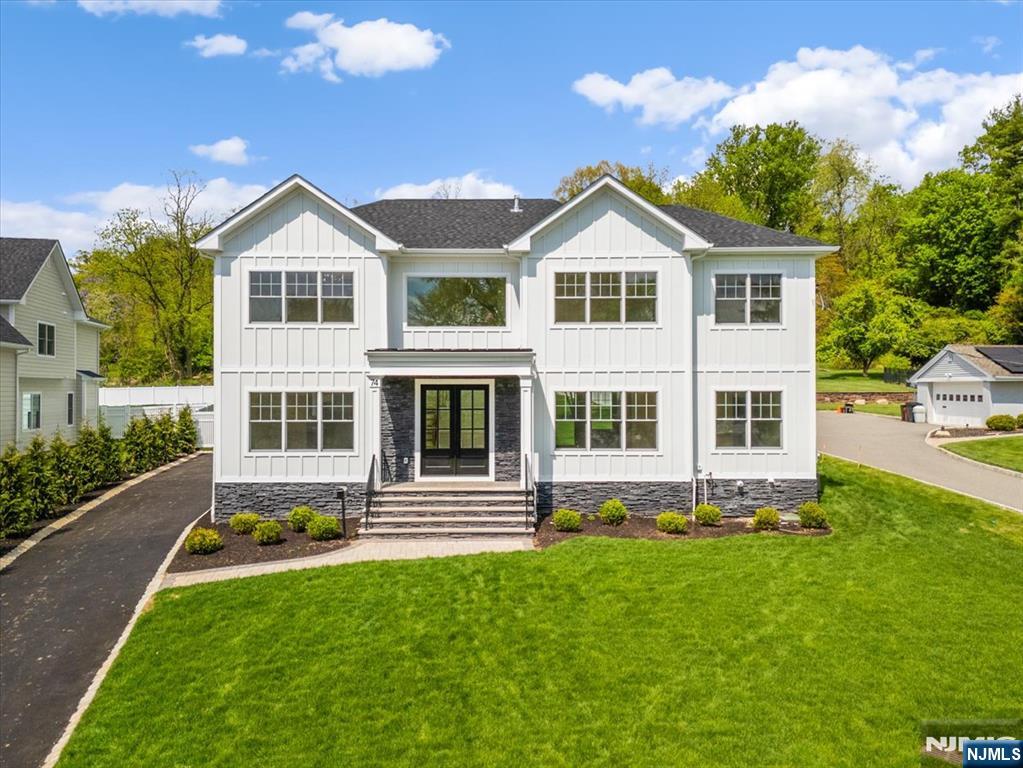 Located in the highly sought-after town of Livingston, this exceptional new construction home offers luxury living, top-rated schools, and an easy commute to New York City. Set on a rare .47-acre lot with mountain views, this stunning Center Hall Colonial offers approximately 5,000 sq ft across three finished levels with 6 bedrooms and 5.5 baths. A grand double-door entry opens to a dramatic foyer featuring oak herringbone hardwood floors throughout the first and second levels, with durable LVT flooring on the lower level. Designed for both entertaining and everyday living, the open layout seamlessly connects the dining room, living room, family room, and chefâ€™s kitchen, all enhanced by soaring 10-foot ceilings and access to a private fenced backyard with a stone patio. The gourmet kitchen features stainless steel appliances, a Bertazzoni professional range, and opens to the spacious family room with coffered ceilings and a gas fireplace. The first floor also includes a guest suite, mudroom, and attached 2-car garage. Upstairs, the luxurious primary suite offers coffered ceilings, custom closets, and a spa-like bath with soaking tub and glass-enclosed multi-head shower. Three additional bedrooms and a convenient laundry room complete the second level. The finished lower level includes a recreation area, lounge, kitchenette, sixth bedroom, and full bath, ideal for guests, recreation, or work-from-home flexibility.