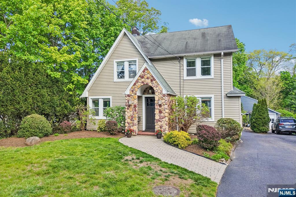 Welcome to this bright and airy Colonial, where timeless character & everyday comfort come together for an unbeatable lifestyle. This 4 bedroom, 2.5 bath home offers a warm & inviting layout, beginning with a gracious living room with fireplace rich in architectural detail & a separate family room designed for relaxed living. The Chefâ€™s kitchen with new 6-burner stove and wall oven, offers easy flow to the dining room & access to the mudroom, convenient 1st floor laundry, bedroom & full bath. The 2nd floor hosts three well-proportioned bedrooms including a large primary bedroom & a junior suite with half bath. The large walk-up attic & full basement provide ample storage and additional space. The private backyard oasis with paver patio is perfect for outdoor dining or a quiet retreat, complete with a two-car garage. Stroll through the Old Country Club neighborhood, Gypsy Pond Park, and close to Orchard school, transportation and downtown Ridgewood