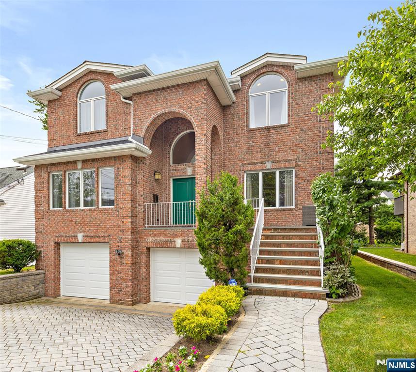 Welcome to 34 Bayview Avenue in the sought-after community of Englewood Cliffs! This expansive 6-Bedroom 4.5-Bath Colonial offers over 5,000 sq ft of beautifully finished living space with a layout designed for both everyday comfort and entertaining. At the heart of the home is a stunning Modiani kitchen with custom cabinetry, Caesarstone countertops, Wolf and Sub-Zero appliances, and a Miele dishwasher. The open plan flows into the dining area and spacious family room with fireplace. French doors lead to a private Trex deck surrounded by lush greenery. Upstairs, the oversized bedrooms include a luxurious primary suite with oversized bath and dual walk-in closets. The finished lower level offers flexible space for a gym, media room, and guest rooms. Additional highlights include hardwood floors, EV charger, top-grade gutters, a 2-car garage, and a paver driveway. Minutes from Fort Lee and the GW Bridge, this move-in-ready home is perfect for commuters.