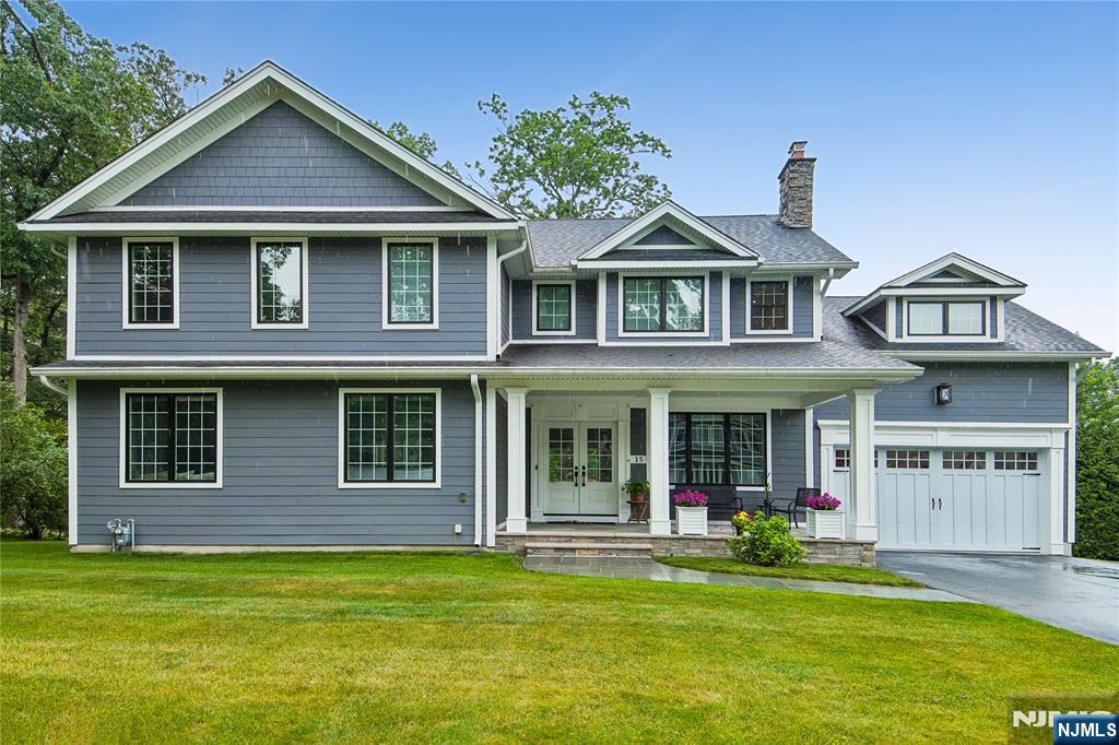 Welcome to Fernwood Drive! This stunning, custom Colonial was built in 2019 on existing foundation and is situated on a quiet street in desirable Fair Lawn. This 4-bedroom, 4.5-bath home offers an open-concept floor plan filled with natural light, detailed trim work, and radiant heat throughout the first floor. The chef's kitchen features abundant cabinetry, an oversized center island, and premium Dacor appliances, flowing seamlessly into the dining room and spacious family room which leads to a beautiful living room with a wood burning fireplace. A mudroom with pantry and powder room leads to the attached 2-car garage with EV charging station. Sliders open to a large deck with a natural gas BBQ hookup. Upstairs, the luxurious primary suite offers two walk-in closets and a gorgeous full bath with radiant heat. Two bedrooms share a Jack-and-Jill bath, while a fourth bedroom includes a full bath. A large laundry room with sink completes the second floor. The finished basement includes a full bath, bonus room, and abundant storage. Additional features include a reverse osmosis system, 13-camera security system, 7-zone sprinklers, first-floor surround sound, and outdoor Bose speakers. A rare opportunity to own a meticulously maintained, move-in-ready home offering modern amenities, sophisticated finishes, and an ideal location close to schools, parks, and transportation.