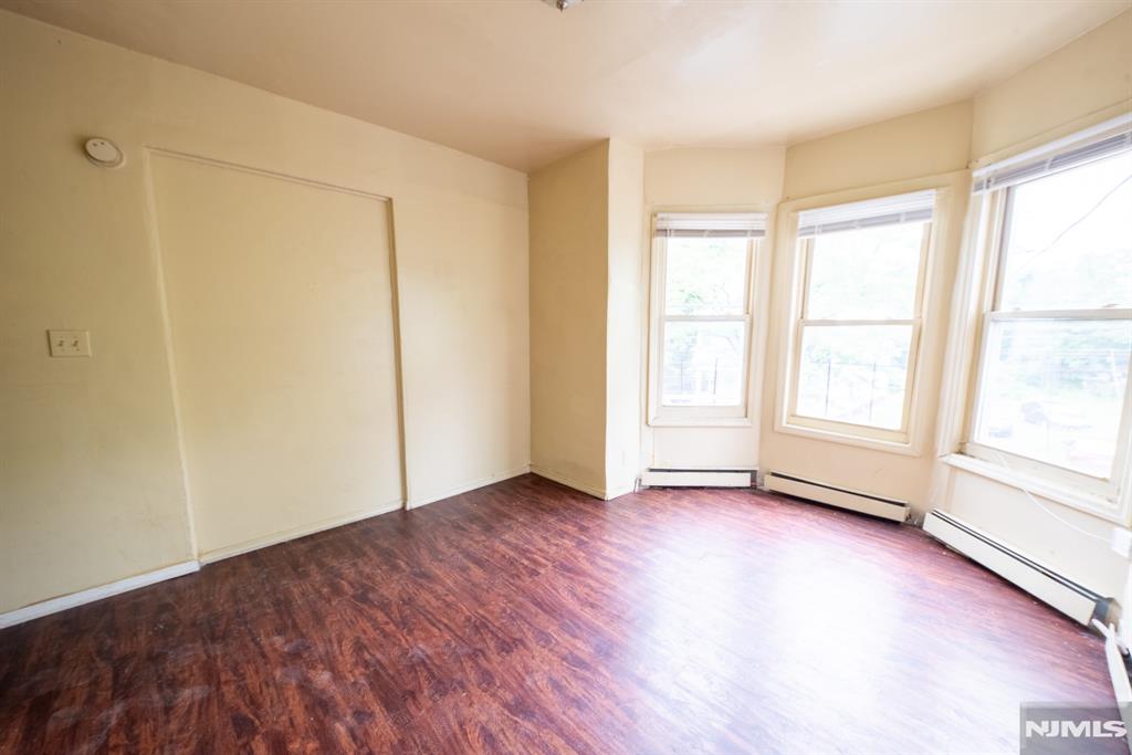 Spacious 3-bedroom, 1-bath apartment offering a comfortable and functional layout. This well-maintained home features a large living room, separate dining room, and plenty of natural light throughout. Enjoy access to the backyard, on-site laundry facilities, and a convenient location near major highways, shopping, dining, and public transportation to NYC.