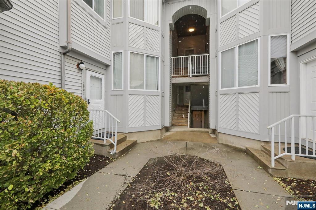 Welcome to this beautifully maintained 2-bedroom, 2-bath condo in the desirable Commons community of Piscataway. This move-in ready home features updated hardwood flooring throughout, a spacious primary suite with full bath and generous closet space, and an updated eat-in kitchen with stainless steel appliances and modern countertops. The bright living room offers a cozy wood-burning fireplace and access to a private deck, perfect for relaxing or entertaining. Laundry facility in unit. The home includes a first-floor attached 2-car garage with extra storage and convenient direct entry into the unit. Enjoy community amenities including playgrounds, tennis courts, parks, and walking paths. Conveniently located near major highways, shopping, Rutgers University, and Edison Train Station with direct service to New York City. Ideal for commuters.