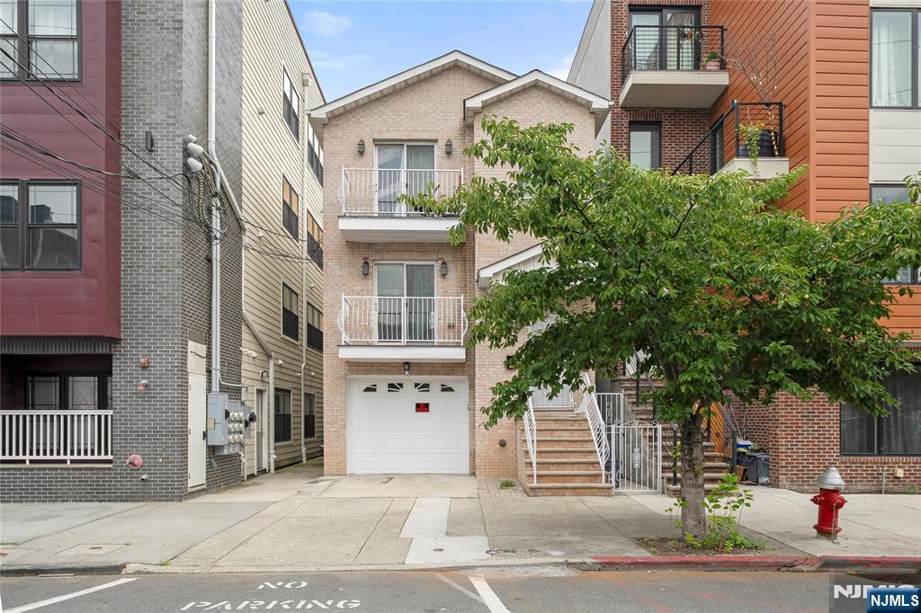 Exceptional investment opportunity in the heart of Journal Square! Built in 2008 and owner-occupied since construction, this well-maintained legal three-family home sits on an oversized 25' x 125' lot and offers modern layouts, quality finishes, and excellent income potential. The first-floor unit features 2 bedrooms and 1 full bath, while the second and third floors each offer 3 bedrooms and 2 full baths. All units include custom kitchens and bathrooms, central A/C and heat. The property also offers a private garage plus additional front parking. Conveniently located just minutes from Journal Square PATH Station, shopping, restaurants, parks, schools, and major transportation. Situated within the Journal Square 2060 Redevelopment Plan, this property presents outstanding investment potential with the opportunity to increase rental income and possible future redevelopment or condominium conversion, subject to buyer due diligence and municipal approvals. Don't miss this rare opportunity to own a newer legal three-family property in one of Jersey City's fastest-growing neighborhoods.
