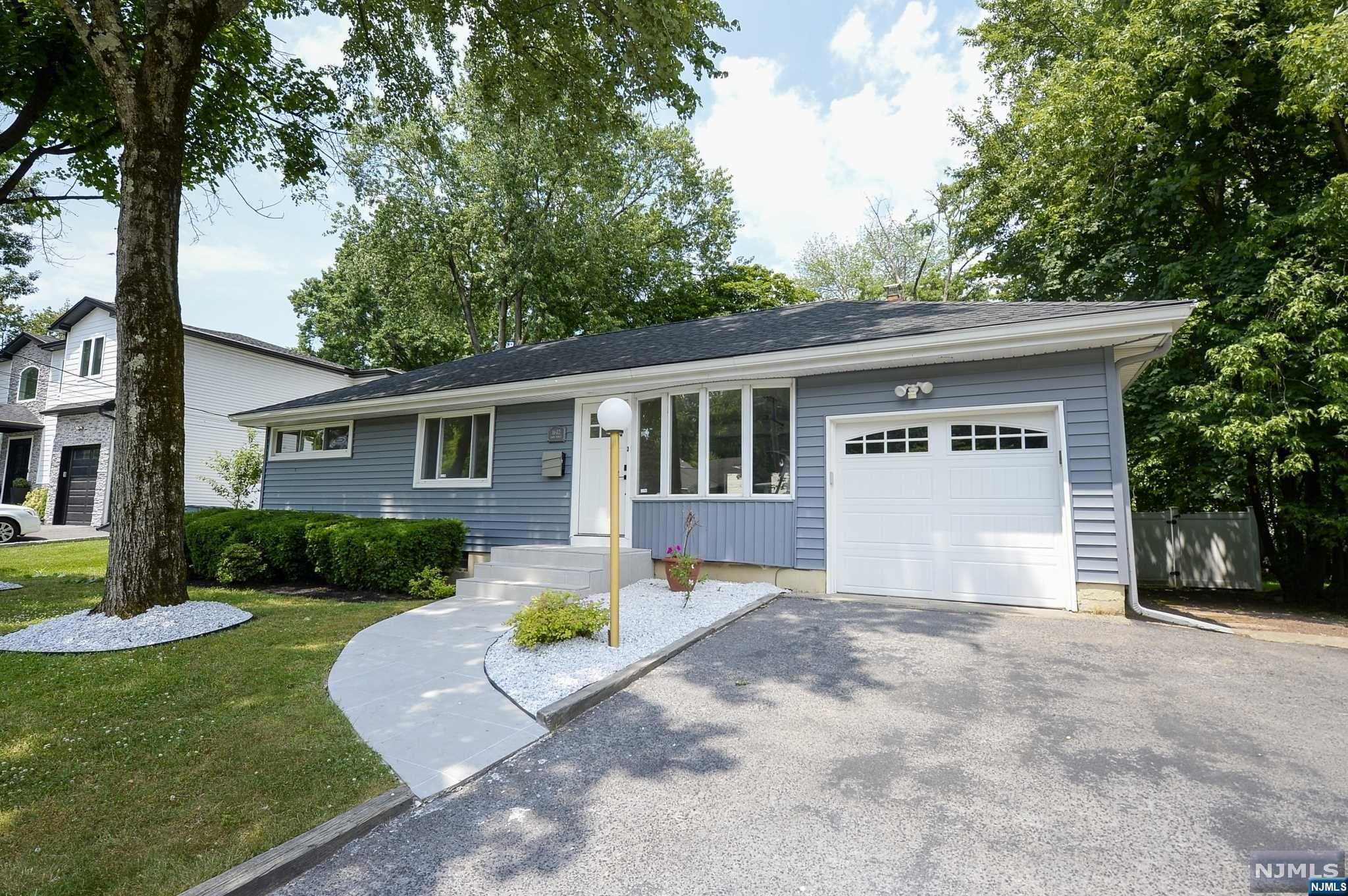 Welcome to this highly desirable, newly renovated home in Fair Lawn! Freshly painted and featuring refinished hardwood floors and all-new doors, this 3-bedroom, 2.5-bathroom home offers ample living space. Upon entry, you are greeted with hardwood flooring that leads through the dining room and into the family room with a wood-burning fireplace, perfect for entertaining. The gorgeously renovated open-concept kitchen boasts stainless steel appliances and bar seating. The first floor also includes three generous-sized bedrooms, including a master suite with a walk-in closet and an en suite bathroom, plus an additional newly renovated bathroom. The fully finished basement adds even more livable space with a rec room, exercise room, laundry area, and ample closet space. Enjoy outdoor living in the fully fenced backyard, complete with both a deck and patio. Don't miss out on own this amazing house in the sought-after town of Fair Lawn!