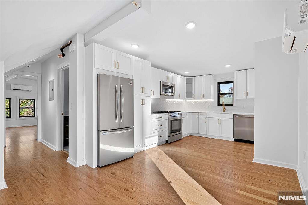Experience modern luxury in this meticulously renovated 1BR/1BA residence with parking, ideally located in the heart of Montclair. Completely transformed in 2025, this spacious 867 sq ft home offers a perfect blend of style, comfort, and convenience. Sun-drenched windows illuminate the open layout, highlighting the gleaming hardwood floors, refined finishes, and airy ambiance throughout. The gourmet kitchen is designed to impress, featuring stainless steel appliances, quartz countertops, and crisp white cabinetryâ€”an ideal space for both cooking and entertaining. The inviting living area extends to a private balcony, perfect for morning coffee or evening relaxation. Additional comforts include a mini-split heating/cooling system for year-round efficiency, in-unit washer/dryer (to be installed by owner), and dedicated parking. Set within an elegant, well-maintained building, this home is just moments from NJ Transit, Nishuane Park, boutique shops, and Montclairâ€™s renowned dining scene. A rare opportunity to enjoy turnkey living in one of the areaâ€™s most desirable communities.
