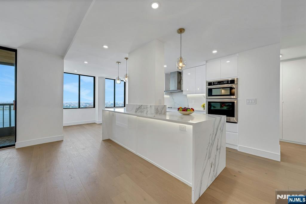 BRIGHT AND SPACIOUS 1,644 SQ. FT. 2-BEDROOM, 2-BATH RESIDENCE WITH BREATHTAKING, UNOBSTRUCTED PANORAMIC VIEWS OF THE HUDSON RIVER STRETCHING FROM THE GEORGE WASHINGTON BRIDGE TO LONG ISLAND. FULLY RENOVATED AND LOCATED IN A LUXURY HIGH-RISE, THIS EXCEPTIONAL HOME OFFERS AN OPEN-CONCEPT LAYOUT, BRAND-NEW OAK HARDWOOD FLOORS, SLEEK EUROPEAN-STYLE DOORS, AND ELEGANT SOFFITS WITH RECESSED LIGHTING. THE STUNNING CHEFâ€™S KITCHEN IS DESIGNED FOR BOTH EVERYDAY LIVING AND ENTERTAINING, FEATURING CUSTOM CABINETRY, QUARTZ COUNTERTOPS, A LARGE CENTER ISLAND, AND ALL-NEW STAINLESS STEEL APPLIANCES. BEAUTIFULLY UPDATED BATHROOMS OFFER CONTEMPORARY TILEWORK, A STYLISH ACCENT WALL, AND LED-LIT NICHES, CREATING A REFINED, SPA-LIKE FEEL. SET IN A FULL-SERVICE BUILDING WITH AMENITIES INCLUDED IN THE MONTHLY MAINTENANCE, THIS HOME ALSO OFFERS UNBEATABLE CONVENIENCE WITH EASY ACCESS TO MAJOR BRIDGES, TUNNELS, FERRIES, AND NYC TRANSPORTATION. *Owner is a licensed NJ real estate agent.*