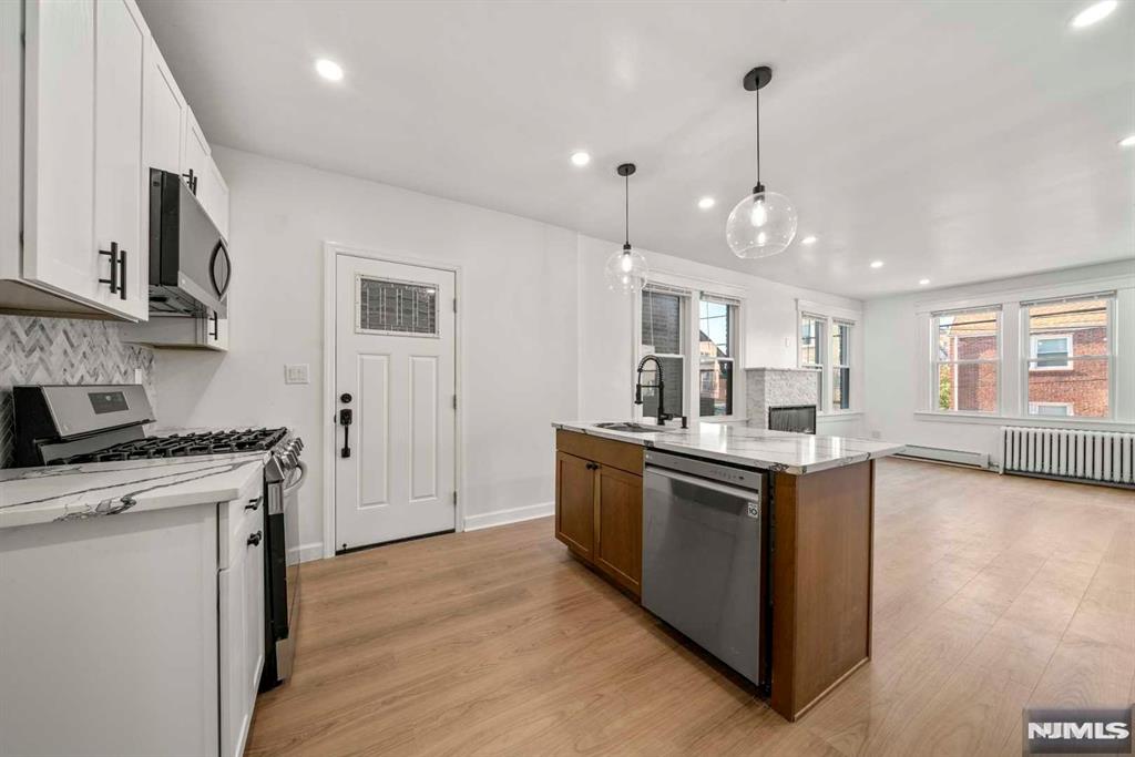 Discover this beautifully renovated 2 bed, 1 bath gem in the heart of Cliffside Park. Featuring a chef's kitchen with stainless steel appliances, granite countertops, and an open concept layout, this home is filled with natural light. Located on desirable Cedar Street, you're just steps from public transportation, shopping, dining, and more. Don't miss the opportunity to make this charming home yours! No Parking included *$100 extra for backyard usage