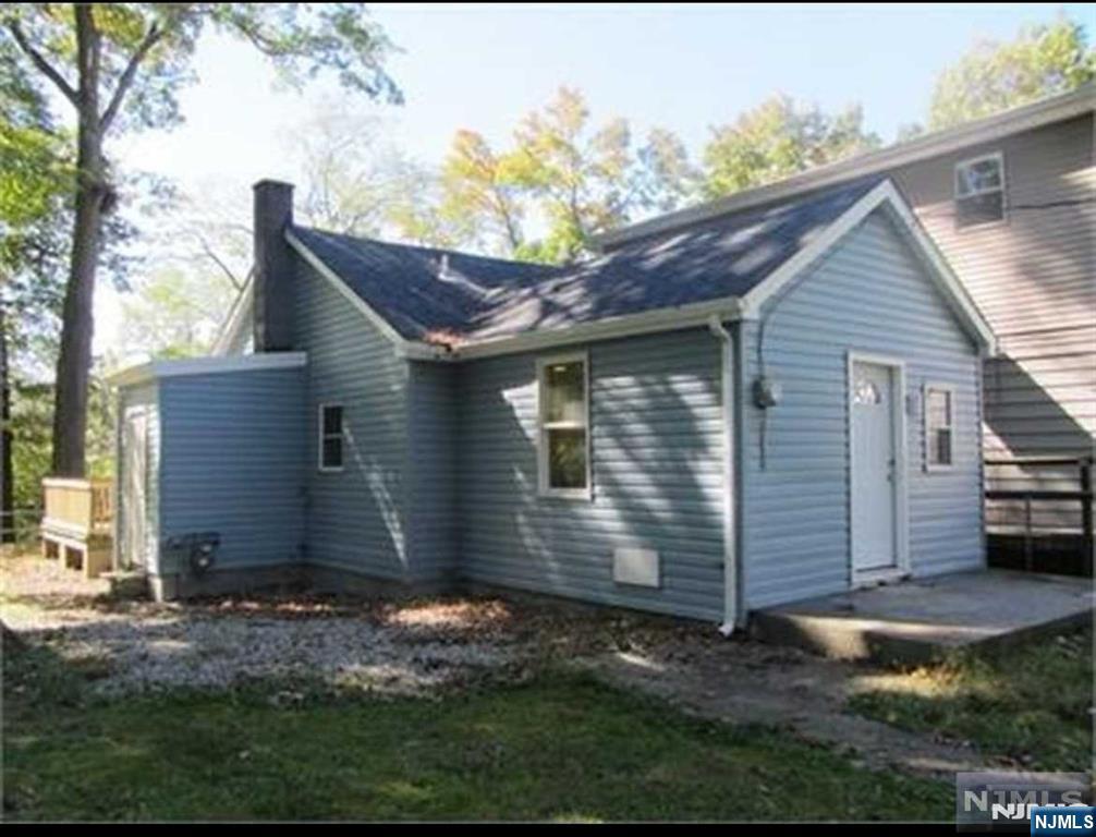 This cozy, 800 sq. ft. house sits nestled along a tranquil riverbank, blending harmoniously with its natural surroundings. The house needs love and care. The exterior features a small inviting front porch, perfect for enjoying morning coffee while listening to the gentle flow of the water. Breathtaking views of the river and flood the interior with natural light. Inside, floor plan combines the living, dining, and kitchen areas into a welcoming space with warm, rustic charm.The compact kitchen features appliances The house includes one main bedroom with a peaceful view of the river and a second smaller room that can serve as a guest bedroom or office. Outdoors, backyard offering a serene spot to fish, read, or simply unwind. Surrounded by lush greenery, this riverside retreat is ideal for anyone seeking simplicity and a strong connection to nature. Great opportunity for first time home buyers. Strictly AS IS SALE.