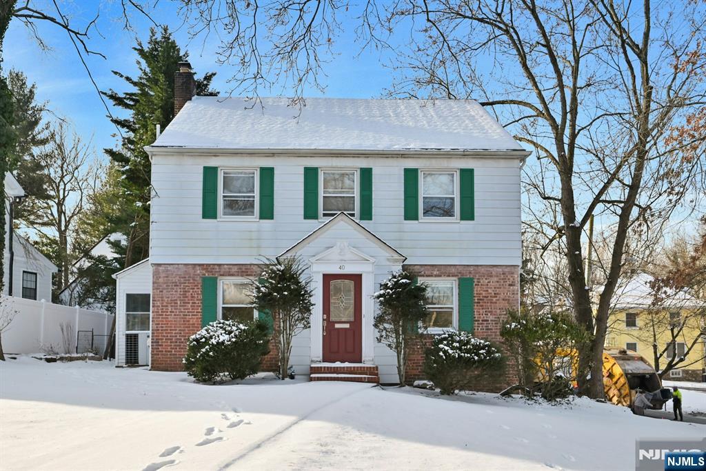 Welcome to 40 E Clinton Avenue, Tenaflyâ€”well maintained and updated 4-bedroom, 2 full bath home located on a quiet, tree-lined street. This property offers a functional layout with an attached one-car garage and comfortable living spaces throughout. The first floor features a kitchen with stainless steel appliances, a bright bedroom or family room with abundant natural light, and a mudroom providing access to the backyard and deck area. The outdoor space is suitable for entertaining or everyday use. The second floor includes additional bedrooms and a full bath with ample closet space. Additional features include hardwood floors and good natural light throughout. Conveniently located near schools, parks, shopping, and public transportation. Donâ€™t miss this wonderful opportunity to own a home in one of Bergen Countyâ€™s most desirable communities!