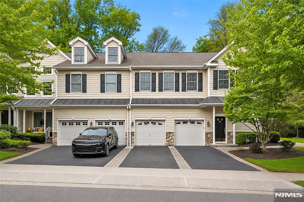 Luxurious Corner Unit Townhome in The Village of Old Tappan offering approx. 2,272 sq ft of beautifully renovated living space! This stunning home features soaring ceilings, gleaming hardwood floors, abundant natural light, and a modern open floor plan. The welcoming foyer with storage closet leads to the main living level featuring a bright living room with dramatic floor-to-ceiling windows, fireplace, and private balcony. The fully renovated custom kitchen offers premium finishes, new appliances, and a sunny breakfast area. A spacious bedroom with large closets and an updated full bath complete the main level. The luxurious primary suite features two closets and a spa-like bath with soaking tub, glass-enclosed shower, and custom double vanity. The upper level offers an enclosed loft-style space with full bath and walk-in closet overlooking the living area â€” ideal as a third bedroom, family room, guest suite, or office. Extensive renovations completed Sept.-Dec. 2024 include all new appliances and replacement flooring throughout with top-quality materials. Central air and heating systems, including outdoor compressor, were replaced in early 2024. Home also includes a generator.Maintenance includes landscaping, snow removal, and amenities. Located in the highly sought-after Old Tappan Blue Ribbon school district with convenient access to NYC transportation.Text/call Sunny Hwang with Re/Max now. Public Open House -06/13/2026 1:30-3:30PM