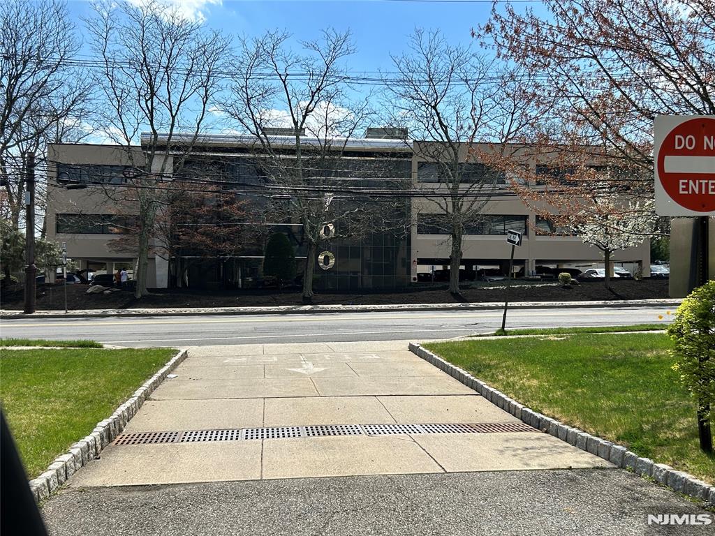 High Visibility Professional Medical Office on Ground Floor Previous Dental Office - 5 treatment rooms, 3 Offices, Patient Reception/Waiting Area, Laboratory, Sterilization, Kitchen, 2 Private Lavatories, Storage. Covered and Ample Lot Parking Available