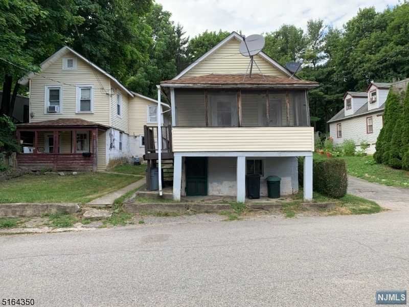 TWO HOMES ON ONE PROPERTY!! LIVE IN ONE AND RENT THE OTHER! Currently rented with long term month to month tenants that are interested in staying. One is a one bed one bath and second is two bed one bath. W/D HOOKUPS. #5 HAS FULL UNFINISHED BASEMENT, #7 HAS PARTIAL FINISHED BASEMENT