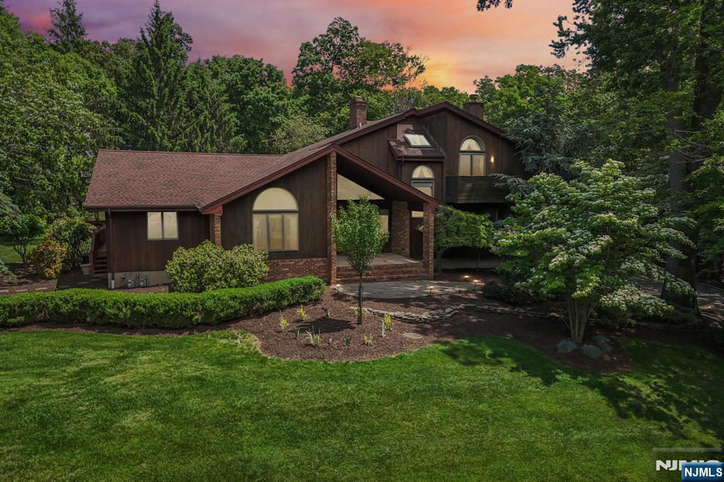 Meticulously maintained & truly one-of-a-kind, this stunning 3BR+office/sunroom 4BTH contemporary â€œzen oasisâ€ offers resort-style living in the heart of Franklin Lakes. Originally renovated & expanded in 2002, this exceptional residence blends California-inspired design with warm, tranquil living spaces, exceptional indoor/outdoor flow, and rich custom woodwork throughoutâ€”reflecting true pride of ownership in every detail. The main level features a custom kitchen, sunroom, great room, dining room, sitting room, full BTH, & a first-floor primary suite with private deck access. The spa-like PR bath offers a jacuzzi, open shower design, and a true retreat-like feel. A second BR is also offered on the main level ideally for a home office. The second level includes two spacious BR and a full BTH. The fully finished lower level expands the living experience with a family room, recreation/billiard area, wet bar, fitness room, a lower-level jacuzzi spa area w/full bath, ideal for entertaining. Step outside to your private backyard sanctuary featuring a gunite pool, multiple decks, koi pond, and beautifully landscaped grounds designed for relaxation and effortless entertaining. Additional highlights include a 2-car attached garage plus a rare 4-car detached garage, 4 new remote-controlled retractable skylights, new roof, brand-new heating system, new gutters, new stovetop, fresh interior painting, & newly stained decks. A rare opportunity to own this private oasis.