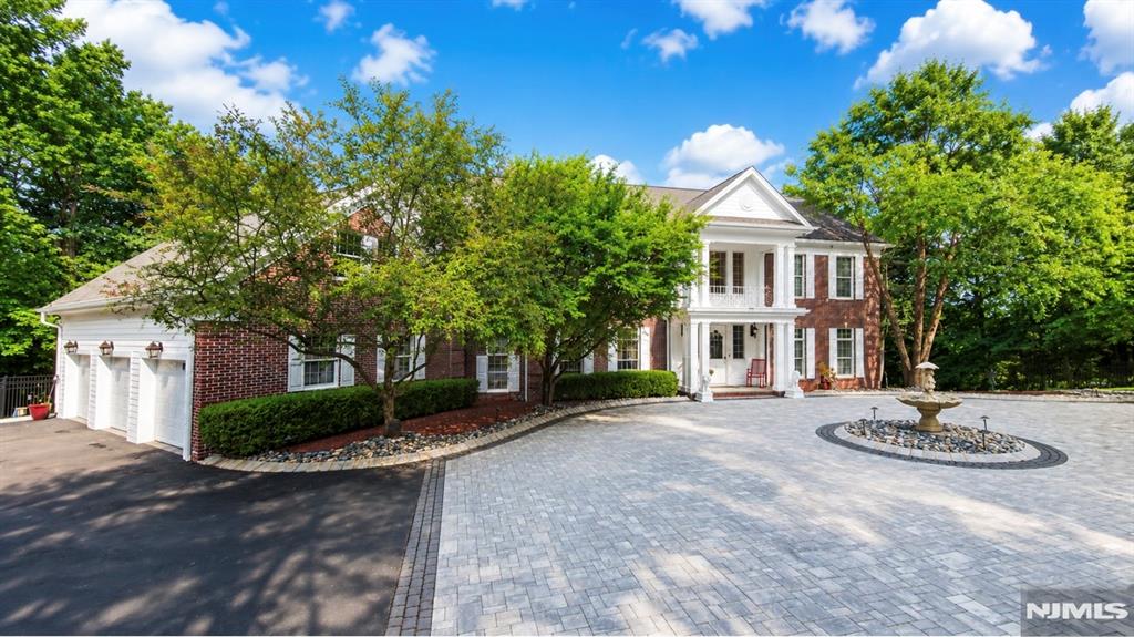 Welcome to your Private Retreat!! This Beautiful Stately Williamsburg Colonial Brick Home is Gracefully set on 1.84 Acre at the end of cul de sac w/complete privacy bordering preserve. 15+car circular paver driveway and 3 car garage. Grand 2 story entry foyer, formal dining rm, formal living rm w/french doors to great room w/11' ceilings, custom solid oak beams, custom moldings, fireplace, wall/wall custom built in library/bookshelves. Windows across back wall of great rm w/gorgeous views. Door to the wraparound deck w/fireplace, oak wet bar open to the great room. Huge gourmet kitchen w/large center island/ breakfast bar, 2 D/W, 3 walls of custom cherry cabinets, big dining area w/fireplace, and french doors to wraparound deck creating a seamless indoor/outdoor living!! 2 half baths, rear staircases to 2nd floor. and to lower level, mud room, door to 3 car garage and 3rd door to deck and patio. 2nd floor- Primary Suite w/tray ceilings, 2 walk in closets, large master bath w/dual vanities, jacuzzi, and shower. 4 bedrooms w/ensuite baths, big bed rm w/walk in closet, office, laundry room, pull down stairs to full unfinished attic. Ground level offers a huge family room, billiards area, full kitchen for indoor/outdoor entertainment, wine room, theater room, gym, big full bth w/jetted shower. w/o from great room to breathtaking expansive paver patio w/fire pit, built in wet bar, dog run, fenced yard, shed, generator for entire home, CV, 8 zn heat, 4 zn CAC, ADT alarm system Etc