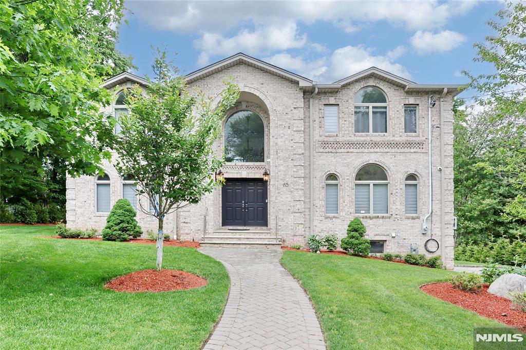 Premier Colonial â€“ 5 Bed, 5 Bath, 3,724 Sq. Ft. Built 2008. Set in Demarest's esteemed East Hill. Custom all-brick center-hall design featuring a two-story foyer with radiant-heated marble flooring, crown moldings, 9' ceilings, two-story great room with fireplace, and formal dining room. Chef's kitchen: Viking appliances, granite island, radiant heat. Walk-out to custom deck. Hardwood floors throughout. Primary suite: walk-in closets, tray ceiling, jacuzzi, dual vanity, radiant heat. Finished lower level with full bath and recreation room. 3 Car Garage, Paver driveway, central vacuum, professional landscaping. Moments to NYC transit and top-rated schools. Listing agent to be present for all showings.