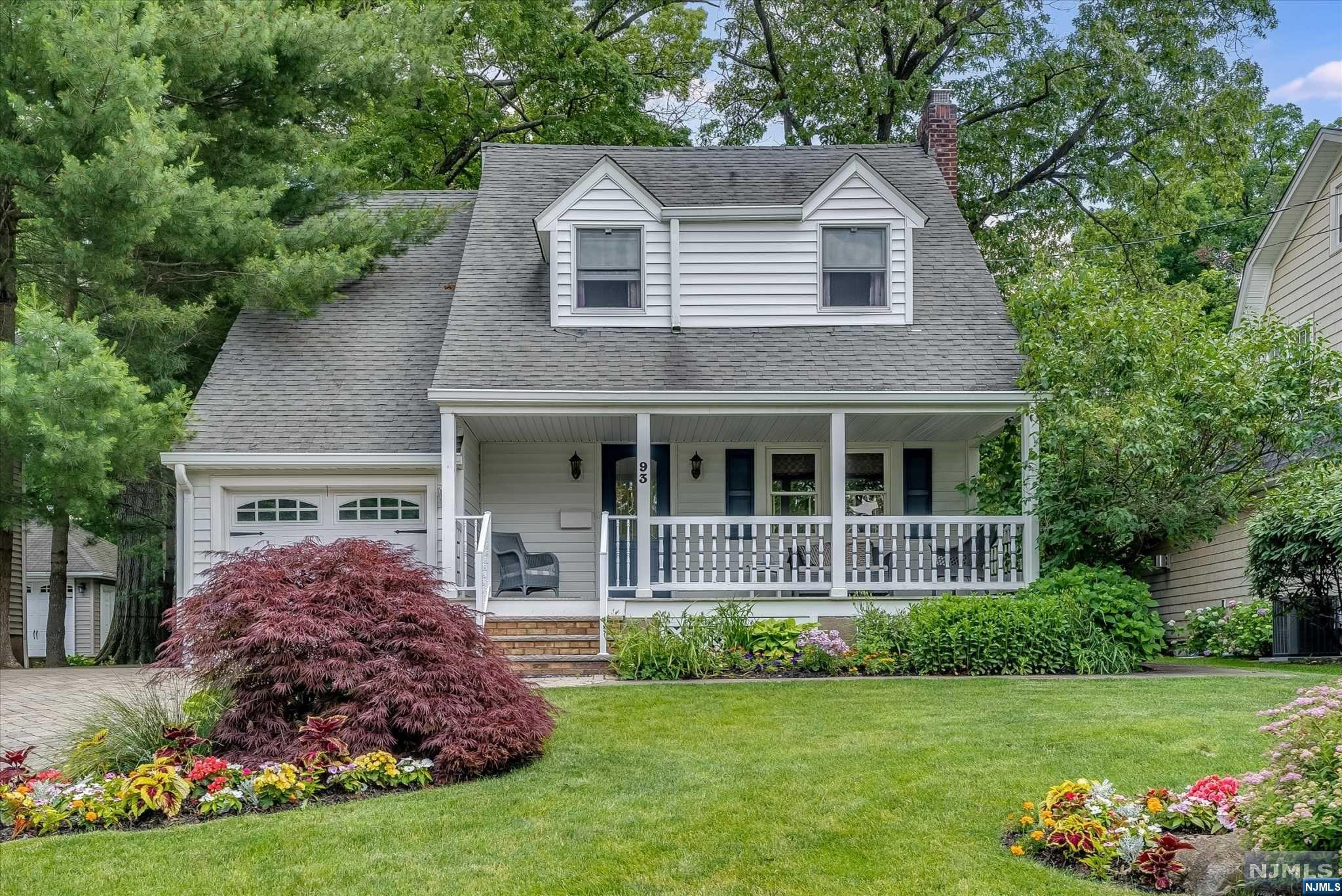 Welcome to this charming home bursting w/warmth & character perfectly situated steps from Glen Rock's vibrant downtown & NYC transportation. Center hall openly flows between LR w/wood burning fplc, DR & MEIK all graced w/hrdwd floors. Updated kitchen boasts Viking range, center island, & farmhouse sink adding a beautiful touch of nostalgia. 1st floor bath continues rustic charm & comfort w/deep jetted tub. Expansive 2nd floor presents primary suite, 4 bedrooms & hall bath, offering great lifestyle flexibility. Primary suite's 2 walk-in closets & updated full bath w/tranquil tones offers a relaxing retreat. Outside backyard is a true oasis, w/lush & colorful plantings, approximately 203' deep, highlighted by a koi pond & the tranquil sound of running water. Deck & patio provide great space for entertaining all within a private peaceful setting. Finished basement, CA, incredible storage, front porch w/timber tech floor, this home is a true haven and best of all, no car needed!