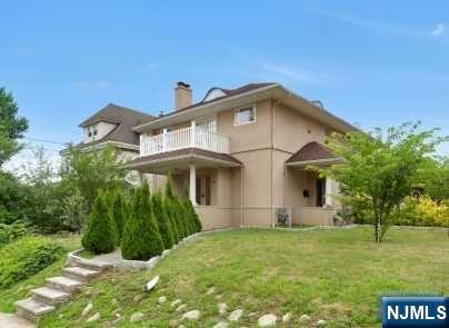 2 bedrooms and 3 baths with ss appliances, gas fireplace, hardwood floors, washer/dryer and central air. Large full fin. basement. Plenty of storage. Off street parking. Close to hospital and NYC transportation. Lots of living space. A must see!