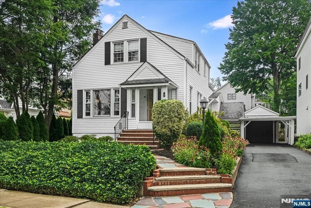 Pristine colonial home on an oversized lot! Abutting the Rosemawr section of Clifton and just a few short blocks from Mayor Johnson Park and NJ Transit Train station, this home features 3 bedrooms, 1.5 bathrooms, and a large backyard. Surrounded by lush greenery, the inviting front porch welcomes you with a sense of home the moment you arrive. Through a French door and by the entrance, the living/dining room offers beaming hardwood floors, plenty of natural light and a wood-burning fireplace. Newer windows throughout this impeccably clean-well cared for home. First floor also features 3rd bedroom in the rear of the home, side entry/exit to covered area that connects to oversized garage. Back room offers tons of windows, and door to private deck area. Sizable kitchen, dining room, and half bathroom complete the first floor. Hardwood flooring continues on the second floor and throughout the 2 spacious bedrooms with tons of windows and natural light. Second floor also features a full bathroom with tub/shower. Full basement is completely open concept and has room for endless possibilities. This home includes plenty of space for parking with 1 oversized and covered detached garage as well as a 4-car driveway. Completely covered walkway from garage to side entrance. The deck and large backyard make this home perfect for entertaining! Conveniently located near Promenade Shops of Clifton, Rt 3 and NJ transit bus routes, and Houses of Worship.