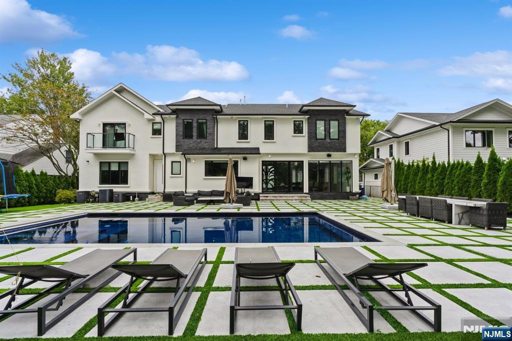 A rare opportunity to own a true luxury retreat in one of Tenaflyâ€™s most coveted neighborhoods. Built in 2016 and offering over 6,000 sq ft, this exceptional residence delivers the lifestyle todayâ€™s high end buyer seeks: open, sun filled spaces, seamless indoor-outdoor living, and turnkey sophistication. Soaring ceilings and refined finishes set the tone upon entry. The chefâ€™s kitchen impresses with premium appliances, an oversized island, and effortless flow into the expansive family room with integrated surround sound ideal for entertaining on any scale. The primary suite offers a private retreat with a spa-like bath and 2 generous custom closets. Additional bedrooms are thoughtfully designed, while the fully finished lower level adds exceptional versatility with a private gym, guest suite with full bath, and flexible space for work or recreation.The backyard is designed for resort style living, featuring a saltwater heated pool, Jacuzzi, full outdoor kitchen, and beautifully landscaped grounds perfect for entertaining or relaxing. Indoor and outdoor sound system throughout.Additional highlights include a full-house generator for added comfort and peace of mind.Located just minutes from Tenaflyâ€™s top-rated schools, parks, and vibrant downtown, this home offers the perfect blend of luxury, comfort, and convenience.