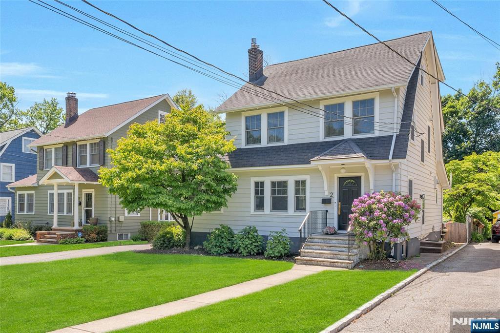 Location and modern sophistication! Welcome to 2 Columbus Ave! Beautifully renovated and completely move-in ready, this Side Hall Colonial offers 4 bedrooms and 2.5 baths on one of Montclair's most sought-after side streets. Just minutes from Walnut Street shops, restaurants, breweries, bakeries, the farmers market, and Midtown Direct train. The inviting living room features a stunning gas fireplace with fluted marble surround and opens into a spacious family room perfect for gathering. The designer kitchen is a true standout with quartz countertops, center island seating, subway tile backsplash, quartz counters, open shelving, and premium appliances including a 6-burner Wolf range, Sub-Zero refrigerator, Miele dishwasher, and steam convection oven. A butler's pantry adds extra storage and a convenient coffee station. There's also a side porch/den that is a perfect sun-filled home office. An updated powder room completes the 1st floor. Upstairs offers 3 sun-filled bedrooms and an updated hall bath with soaking tub. The private third-floor primary suite feels like a retreat with custom built-ins, sitting area, and spa-like bath with radiant heated floors, dual vanities, and oversized wet room with soaking tub and walk-in shower. Finished lower level with family room, laundry, storage. Brand new hardwood floors, ductless AC, newer windows, 1 car garage, paver patio, fenced in yard. Come enjoy the perfect blend of comfort, elegance, and modern living in the heart of Montclair.