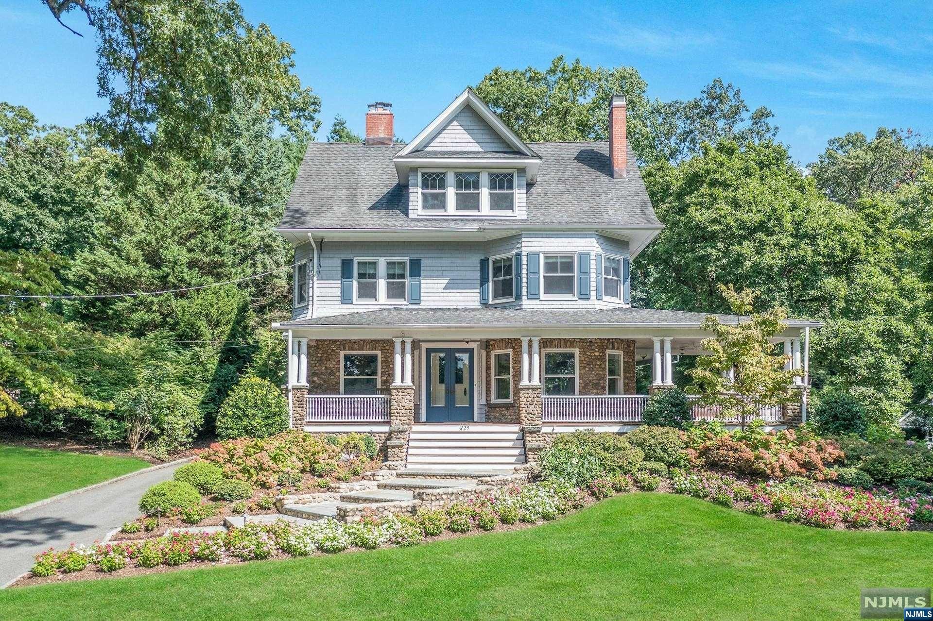 Welcome to 229 Heights Rd, a gracious Edwardian nestled in Ridgewood's coveted Heights neighborhood. Meticulously renovated to maintain its historical character, this home boasts updated architectural design and impeccable details throughout. Prepare to be captivated by the mahogany wrap-around porch,a perfect setting for morning coffee or an evening w/friends. Hammer & Nail gourmet kitchen seamlessly blends style & functionality w/custom Rutt cabinetry and top-of-the-line appliances. Entertain at the oversized marble island and sun-drenched breakfast rm, flowing graciously into the inviting family rm. Six bdrms, three full baths & second flr laundry rm. Stunning primary suite is a retreat unto itself, boasting a white marble bath & custom WIC. Third flr also includes a new unfinished bonus space. Oversized basement w/rec rm, gym & PR. Privacy abounds w/prof landscaping. Steps to NYC trains/buses, town & schools. Extraordinary home designed for family & entertaining!