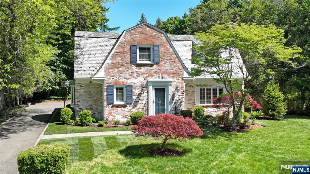 Located on one of Ridgewoodâ€™s most treasured cul-de-sacs in the Somerville School district, 421 Hawthorne Place is a rare offering, available for only the second time in 40 years. Designed in the 1930s by noted architect Carl Kemm Loven, this storybook brick Colonial blends timeless charm with modern living. Set on an extraordinary .44-acre park-like property, the home offers exceptional privacy just moments from downtown Ridgewood, top-rated schools and NYC transportation. The backyard features a thoughtfully designed in-ground pool, built-in hot tub, expansive lawn and multiple spaces for entertaining and play. Inside, gracious formal rooms and beautiful architectural details define the home. The living room features a wood-burning fireplace with Delft tile surround, while the dining room flows into a chefâ€™s kitchen with custom cabinetry, center island and dining area. A spacious family room overlooks the property and opens to a large screened-in porch ideal for indoor/outdoor living. The second floor includes a primary suite with sitting room and spa-like bath with heated floors, plus four additional spacious bedrooms. The lower level offers recreation space, laundry and full bath. A truly special opportunity to own one of Ridgewoodâ€™s hidden gems. Nationally recognized school system, close to downtown shopping and dining and NYC Train and Bus.