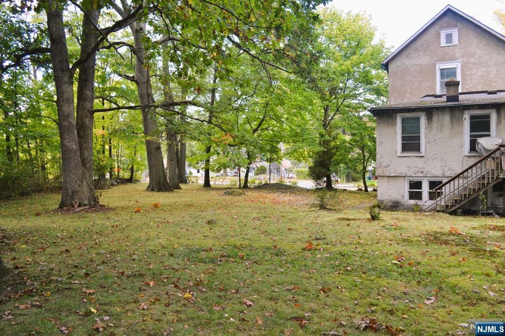 Fantastic opportunity to create your dream home in Bergen County. This home has a history that goes from being a tavern to raising a family. Treed corner property of .38 of an acre to renovate or recreate. This is your chance to live in a town with low property taxes, near to the express train, shopping, restaurants and a well respected school system.