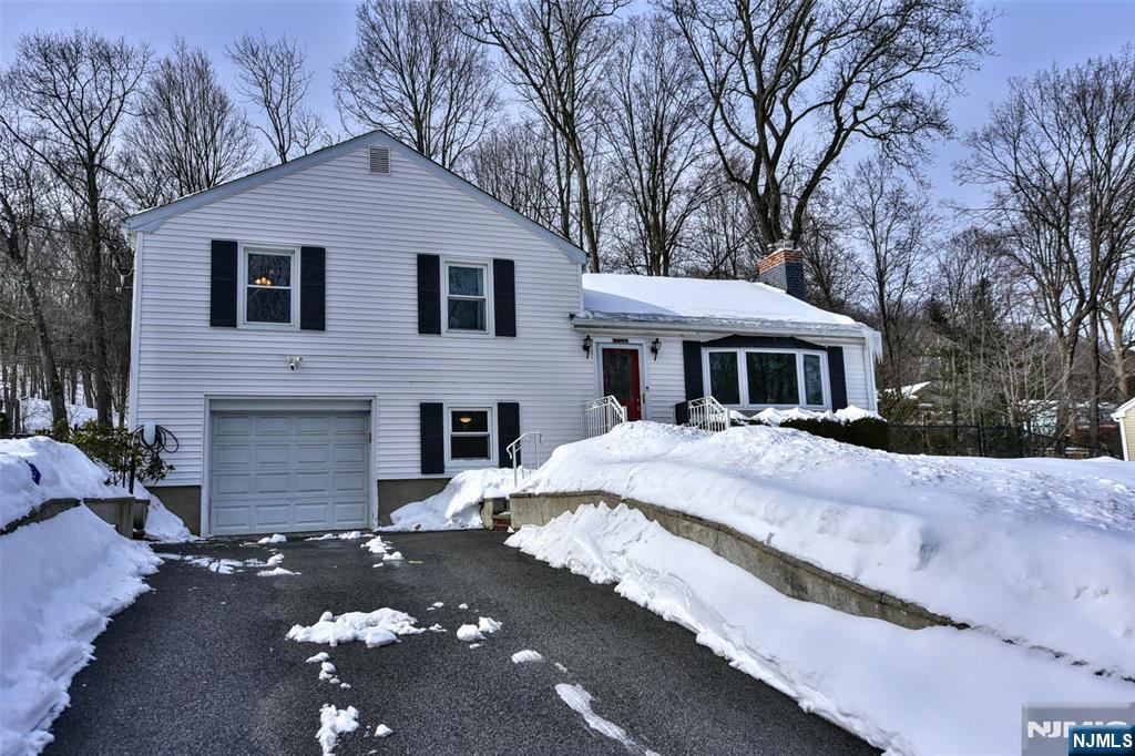 Wonderful opportunity to own in Kinnelon, one of Morris County's most sought-after communities. This lovely 3 BR, 2 BA home, located on a corner lot, offers main level hardwood floors, a wood burning fireplace and updated kitchen open to family room with cathedral ceiling. A feature to this property is the additional ground floor space perfect for a home office, offering a quiet, private environment. For leisure, the finished basement recreation room provides the perfect secondary living space for a home gym, media center, or playroom. Outdoor living is a delight with a spacious backyard, deck, and patio designed for seamless entertaining. Plenty of off street parking. Close to Shopping, Restaurants, Houses of Worship & Major Highways.