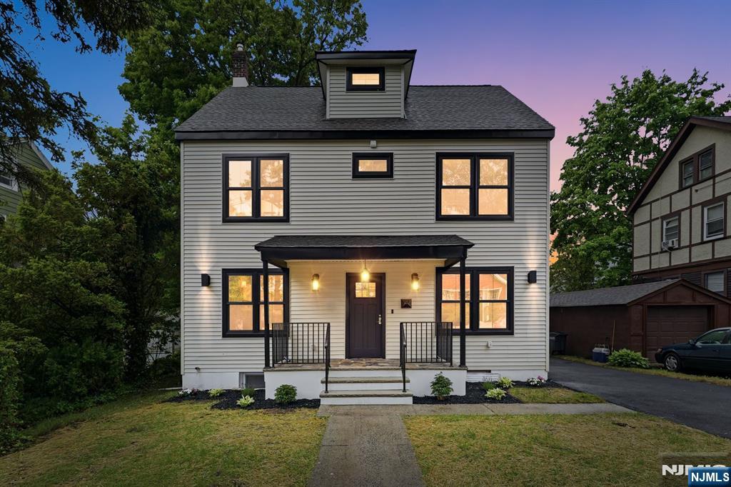 Welcome to this beautifully renovated Colonial in the heart of Montclair, where timeless charm meets modern luxury. This stunning home features 5 bedrooms, 4.1 bathrooms & a thoughtfully designed layout ideal for everyday living & entertaining. Sun-filled interiors showcase designer finishes throughout, including custom moldings,sophisticated lighting & beautifully preserved original hardwood floors that maintain the home's authentic Colonial character.The chef's kitchen features high-end appliances,a dramatic waterfall island, designer backsplash tile & abundant cabinetry, opening seamlessly into an inviting eat-in area highlighted by a striking fireplace feature wall w/ custom paneling. Spacious living & dining areas offer flexibility for both casual & formal gatherings.The 2nd floor offers 3 spacious bedrooms,including a primary suite, plus a convenient laundry room w/ washer & dryer included. The 3rd-floor attic level features 2 additional bedrooms & a full bathroom, providing excellent flexibility for guests, office space or extended living.The fully finished basement offers exceptional bonus living space w/ a full bath, recreation/media room, guest suite potential, large storage room & direct backyard access.The private, low-maintenance backyard features space for outdoor seating, BBQ & play area, plus a brand-new fence for added privacy. Ideally located near Montclair's vibrant downtown, shopping, restaurants & transportation to New York City.