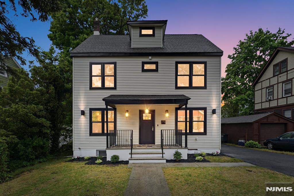Welcome to this beautifully renovated Colonial in the heart of Montclair, where timeless charm meets modern luxury. This stunning home features 5 bedrooms, 4.1 bathrooms & a thoughtfully designed layout ideal for everyday living & entertaining. Sun-filled interiors showcase designer finishes throughout, including custom moldings,sophisticated lighting & beautifully preserved original hardwood floors that maintain the home's authentic Colonial character.The chef's kitchen features high-end appliances,a dramatic waterfall island, designer backsplash tile & abundant cabinetry, opening seamlessly into an inviting eat-in area highlighted by a striking fireplace feature wall w/ custom paneling. Spacious living & dining areas offer flexibility for both casual & formal gatherings.The 2nd floor offers 3 spacious bedrooms,including a primary suite, plus a convenient laundry room w/ washer & dryer included. The 3rd-floor attic level features 2 additional bedrooms & a full bathroom, providing excellent flexibility for guests, office space or extended living.The fully finished basement offers exceptional bonus living space w/ a full bath, recreation/media room, guest suite potential, large storage room & direct backyard access.The private, low-maintenance backyard features space for outdoor seating, BBQ & play area, plus a brand-new fence for added privacy. Ideally located near Montclair's vibrant downtown, shopping, restaurants & transportation to New York City.