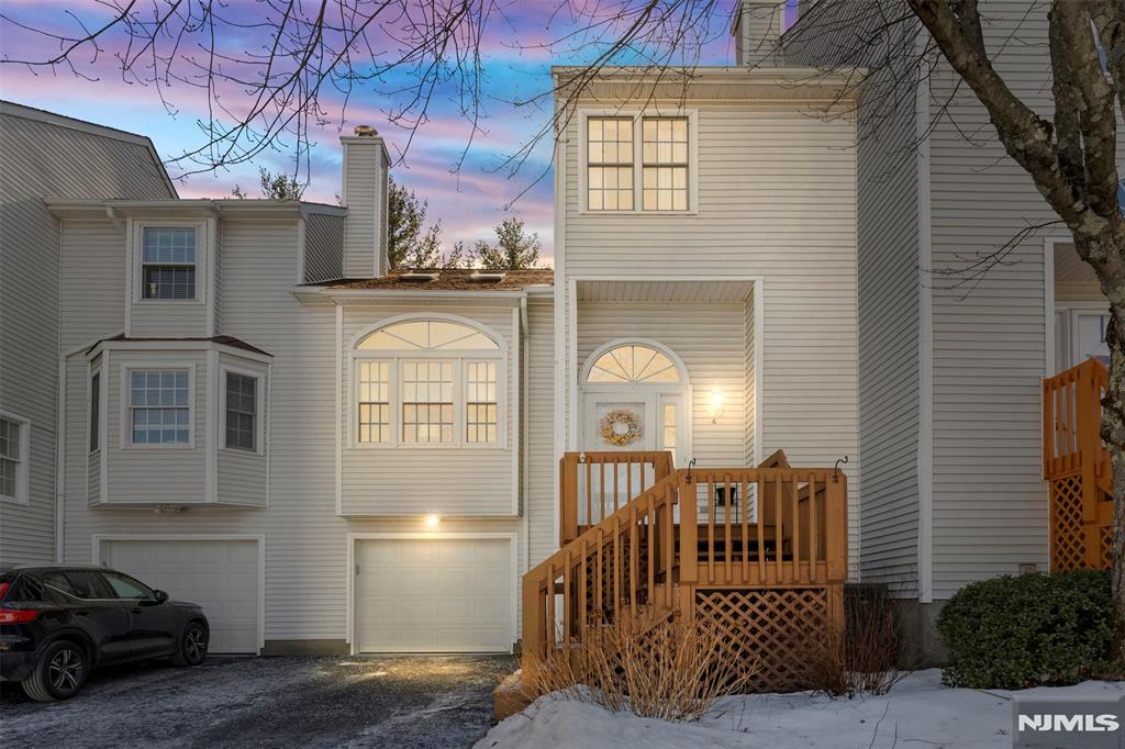 Welcome home to this beautiful 2 bedroom, 2.5 bathroom Barclay model in the desirable Skyline Village! Main level features hardwood floors throughout the living/dining room, bright and open floor plan w/ cathedral ceilings, gas fireplace, powder room and skylights for added natural light! Updated kitchen w/ granite countertops, stainless steel appliances and sliders that bring you out to a private back deck! Upstairs offers a master suite w/ another set of sliders to an upper deck, second bedroom and hallway bathroom. Basement features garage access to a large one car garage, finished rec area, laundry/utility room w/ ample storage space! Full house water softener, newer HVAC and hot water heater! Skyline Village features an outdoor heated pool and clubhouse! This is a must see!