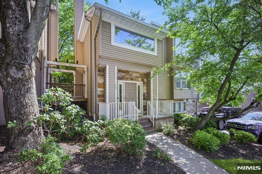 Fully renovated and sun-drenched, this 2 bed, 2 1/2 bath condo w/ 2 car garage in the highly desirable Crystal Woods development is what you've been waiting for. The main living floor is anchored by the fully renovated kitchen w/ sliding glass door to a private porch. The living room has a cozy wood burning fireplace and access to a second porch. A huge family room offers many options for flexible living. Dining room (virtually staged) and renovated powder room complete the first floor. Upstairs you find 2 bedrooms, 2 full baths, and the perfectly located laundry. The primary suite offers a huge bedroom w/ space for an office or gym, a walk-in closet, and a beautiful bathroom retreat complete w/ 2 sinks, soaking tub, and stall shower. Second bedroom is virtually staged. Basement includes storage and utility rooms plus a den/office. Appreciate the peace and quiet sharing no walls with a neighbor. Zero carpet here, it's all wood or tile. Well managed community includes a pool, tennis/pickleball, and playground. Incredible proximity to shopping w/ Whole Foods, Target (brand new) and Trader Joes (coming soon) 1 mile away. Montclair, one of the top dining and shopping destinations in the state, is less than 4 miles. Commuting is a breeze, options include park and ride bus to Port Authority or quick drive to a train station with plenty of parking. Highly rated schools complete the package, with the elementary and high school less than one mile away.