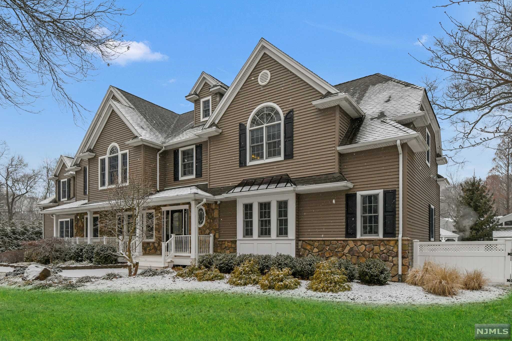 This meticulously maintained home is located on one of the most desirable streets in Wyckoff. The first floor features a en-suite bedroom, large bedroom/office and half bath, the 2nd floor features a laundry room, 3 large Bedrooms, 2 full baths, and a large master bedroom suite w/dual vanities, 2 WIC. The oversized kitchen has a large double island, breakfast nook, built-in Meile coffee/espresso maker, high end appliances and plenty of cabinet space. The home is situated on over 1/2 acre of professionally landscaped property. The backyard and pool area give the home a true resort like feeling, a true entertainer's dream, with a salt water liner pool, cabana with running water, refrigerator, huge Azek deck off of the family room and a large flat yard. In the basement there is a 700 bottle wine cellar, workout area, and small kitchen. High efficiency HVAC and LED lighting throughout, whole house generator, in home A/V system. Walk to Calvin Coolidge School and NYC transportation.
